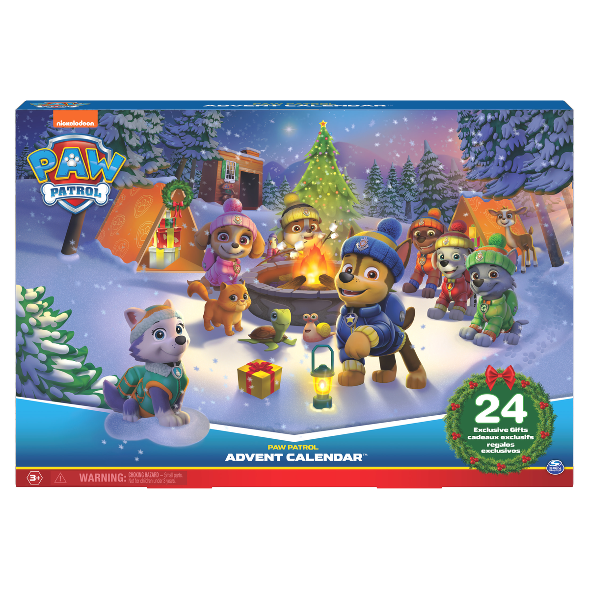 Paw Patrol Adventskalender mit Figuren um Weihnachtsbaum und Lagerfeuer.