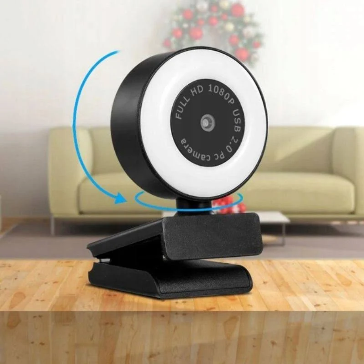 Kamera internetowa z światłem pierścieniowym, na statywie. Światło jest włączone.