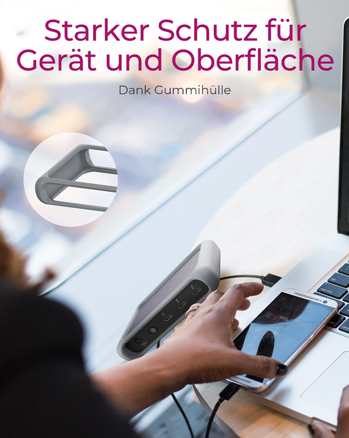 Hand in der Nähe eines Laptops und eines Geräts mit Anschlüssen.
