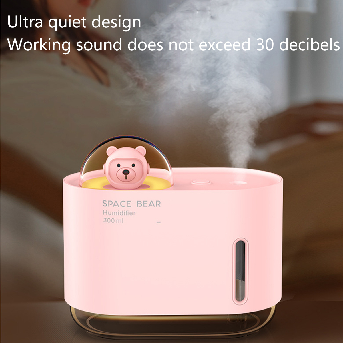 Pinker Luftbefeuchter mit Bärenfigur, der weißen Nebel erzeugt.