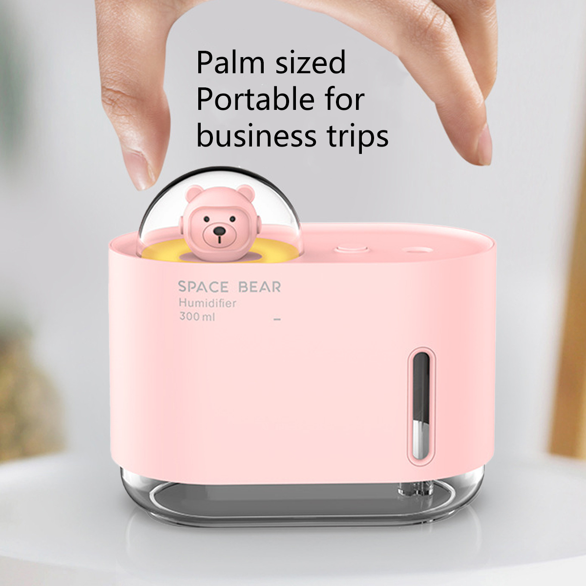 Rosa SPACE BEAR Luftbefeuchter, Bärenfigur innen, Textüberlagerung oben.