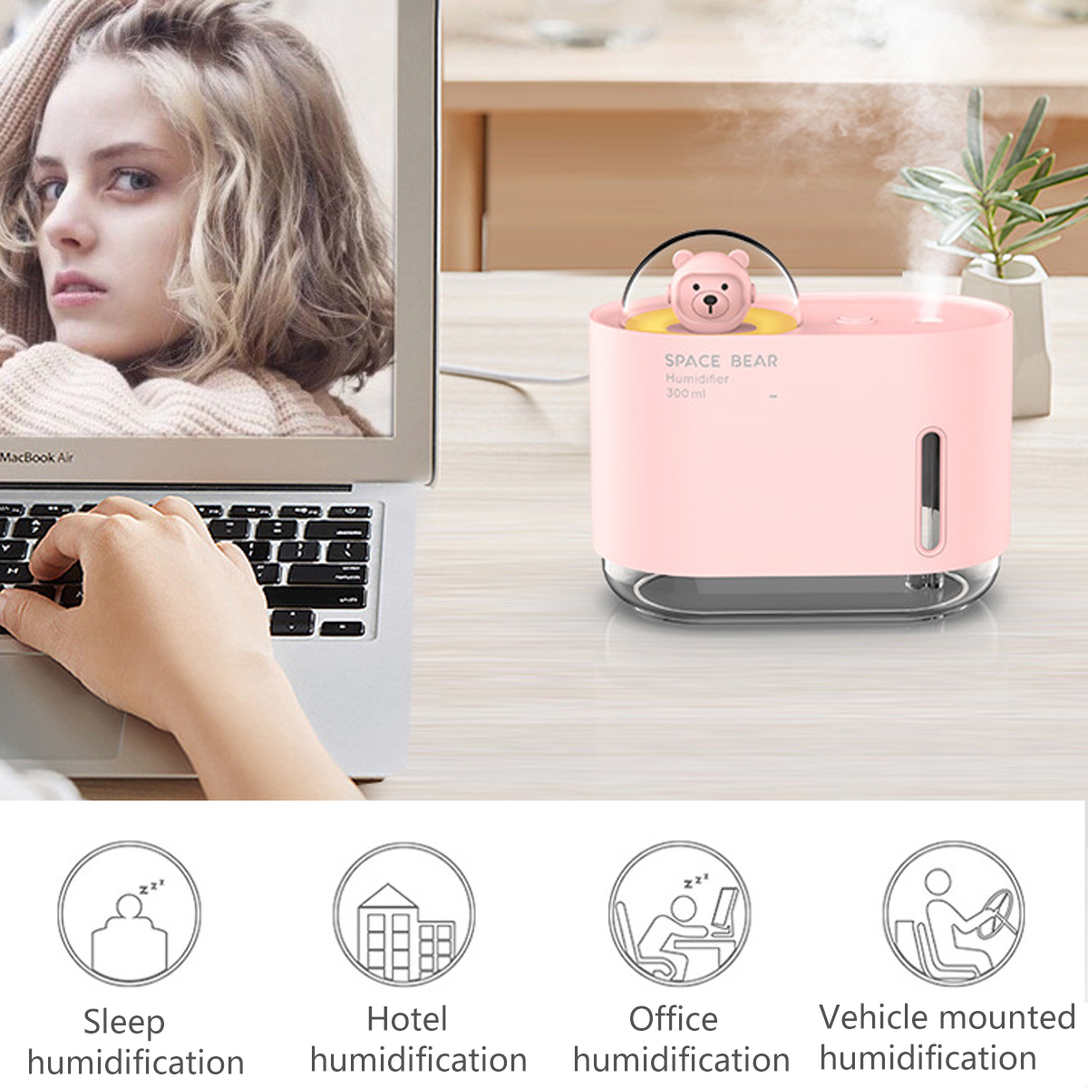 Frau, die einen Laptop benutzt, mit einem rosa Luftbefeuchter rechts.