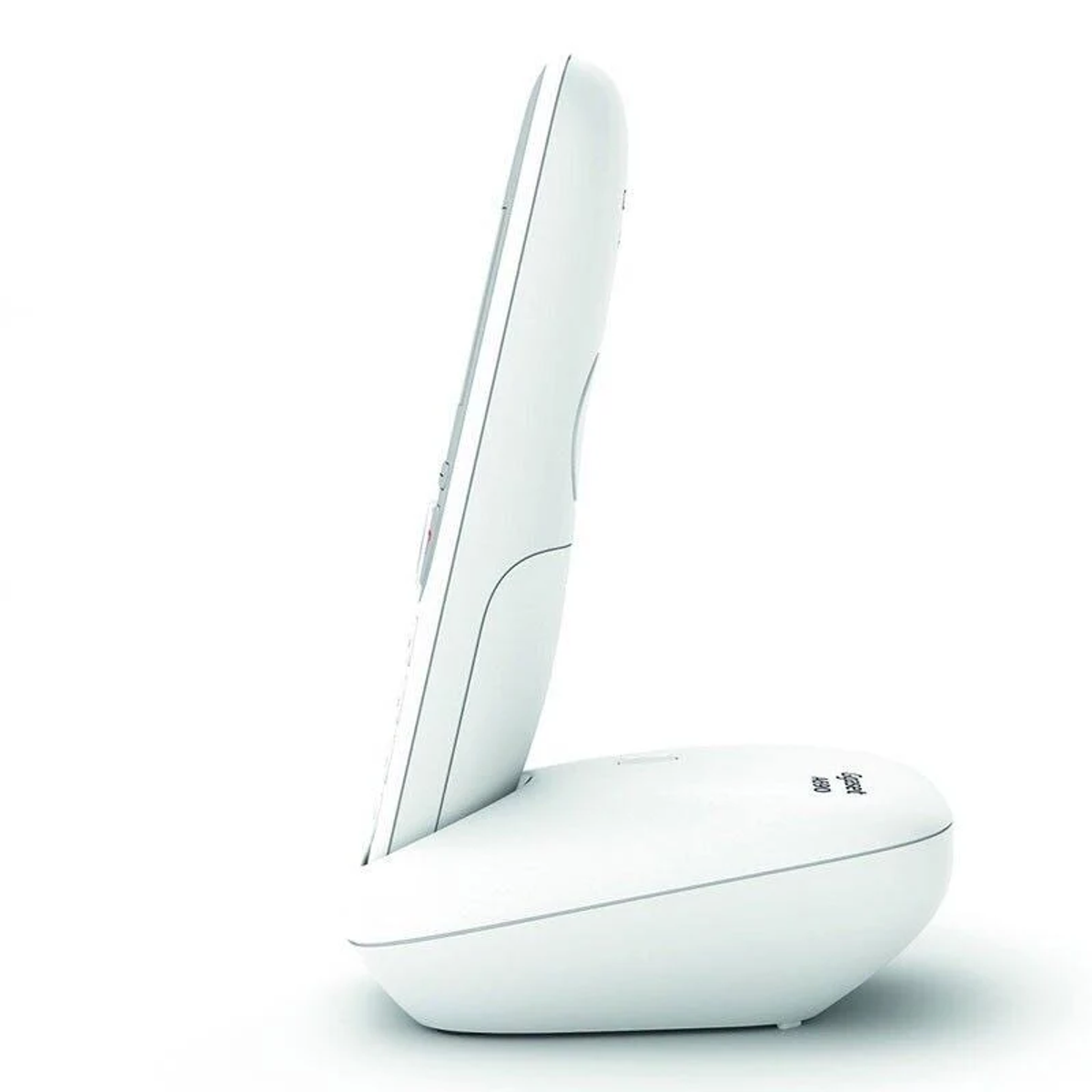 Weißes schnurloses Telefon auf seiner Basis, Seitenansicht. Die Basis ist oval geformt.