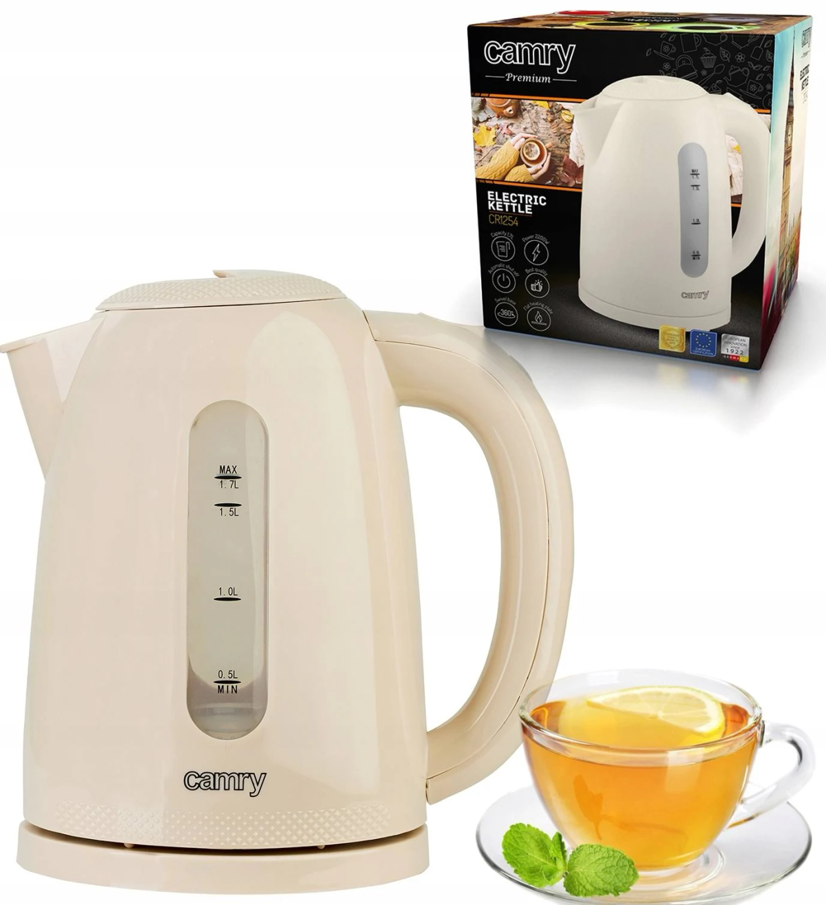 Kremowy czajnik elektryczny, pudełko i filiżanka herbaty z cytryną i miętą.
