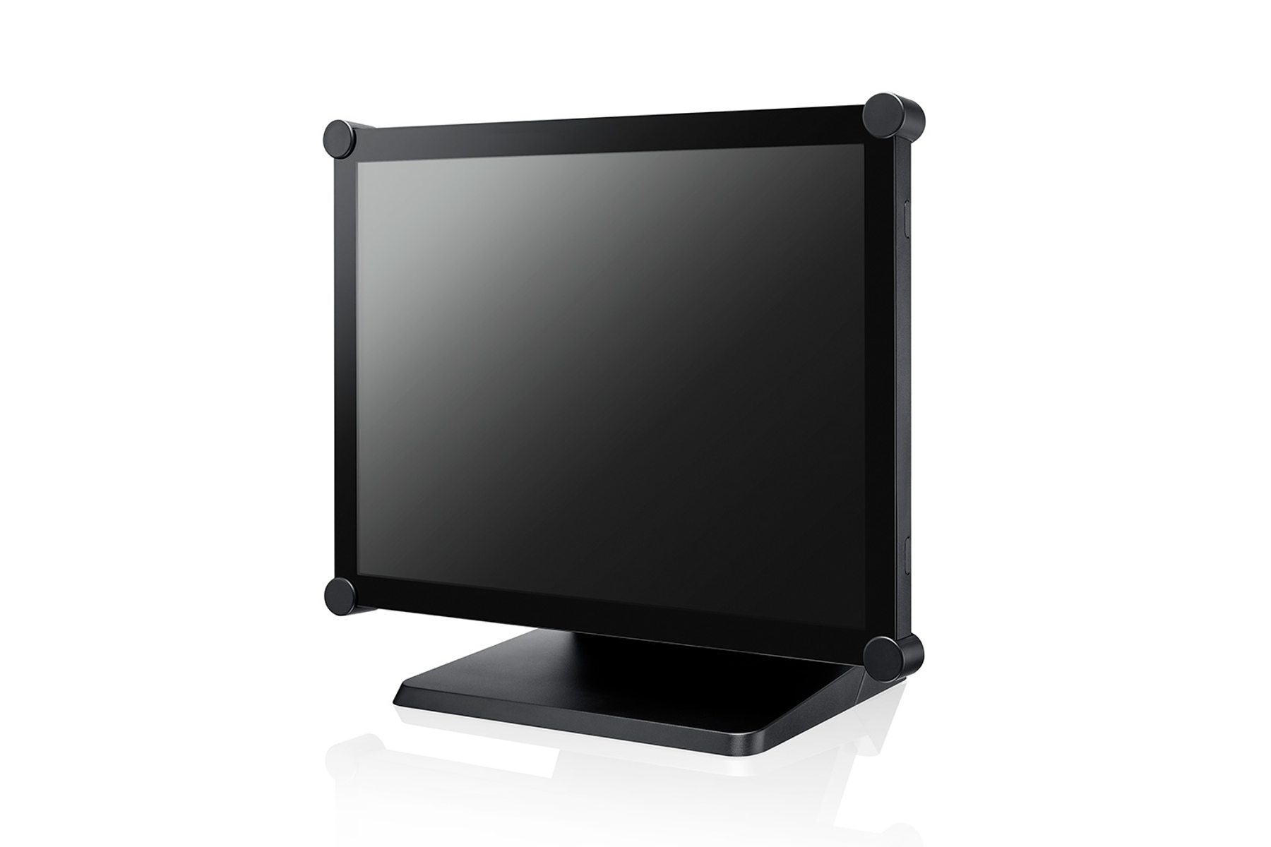 A black monitor is on a white surface. It has a black stand and is against a white backdrop.