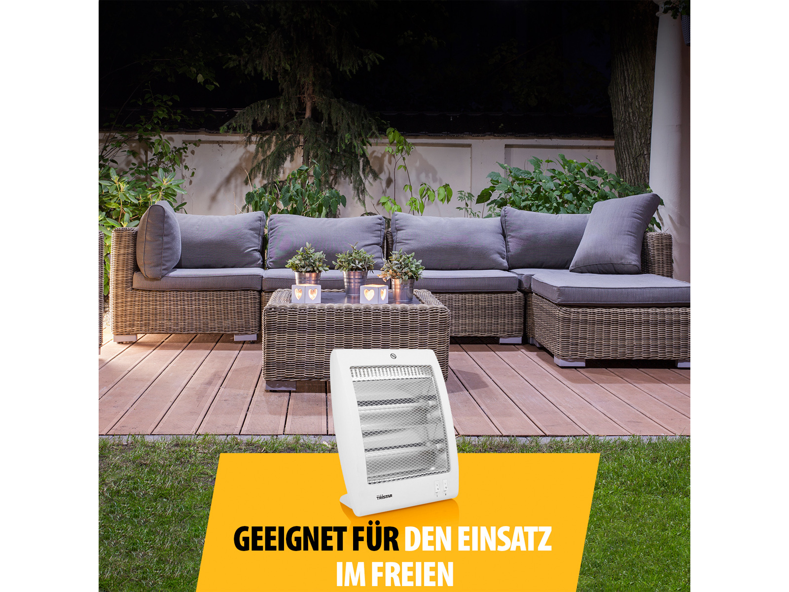 Weißer Elektroheizer auf einer Holzterrasse, mit Sitzgelegenheiten im Hintergrund.