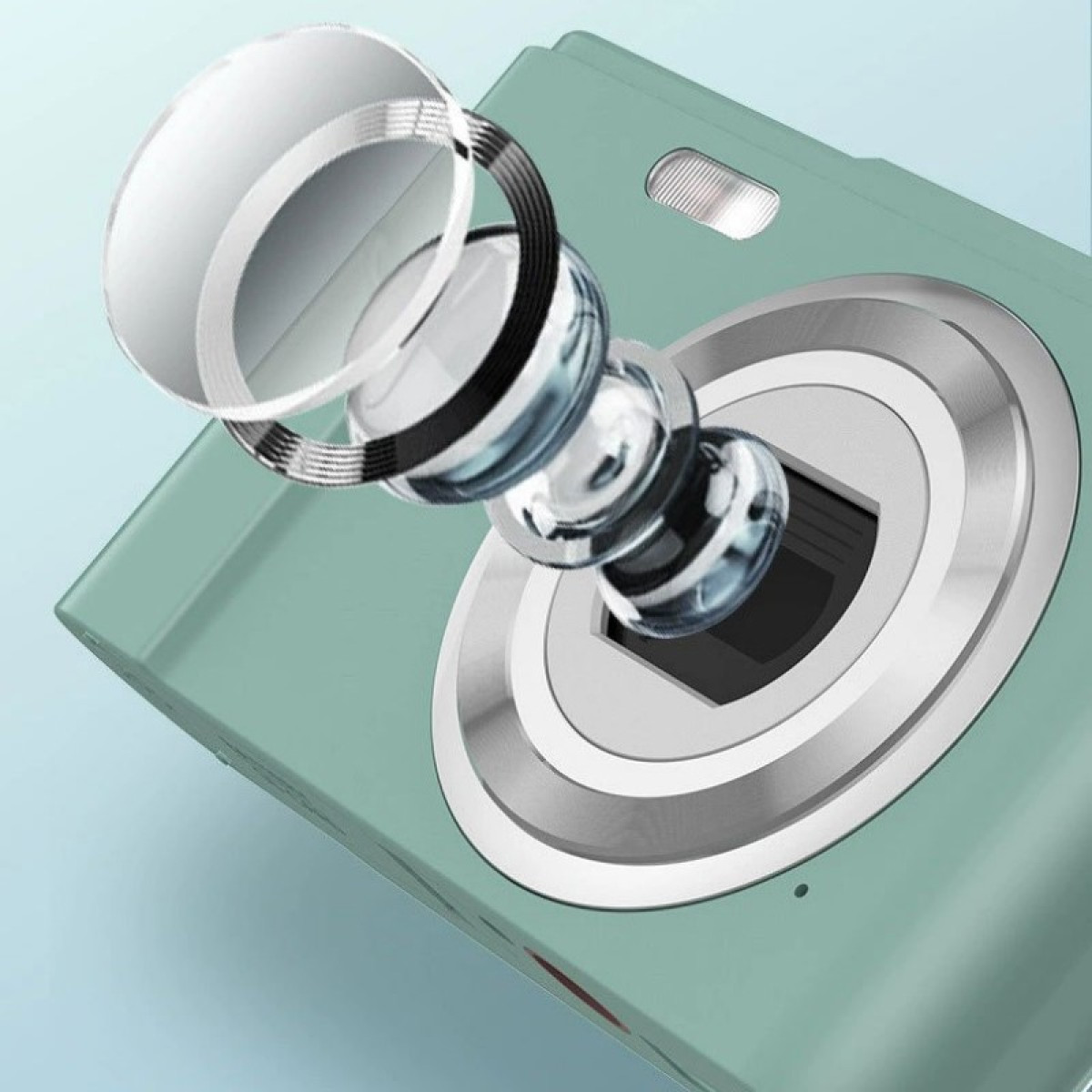 Zbliżenie miętowo-zielonego aparatu z zespołem obiektywu z przodu, pokazującym komponenty wewnętrzne.