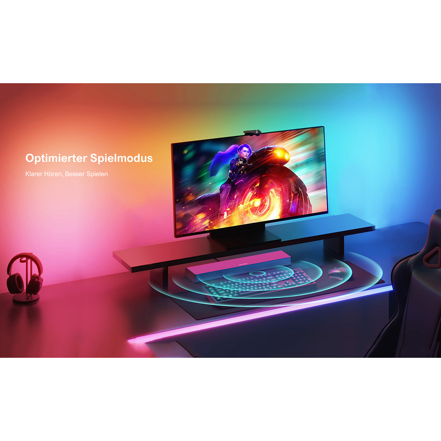 Gaming-Setup mit Monitor, Headset, Tastatur und RGB-Beleuchtung.