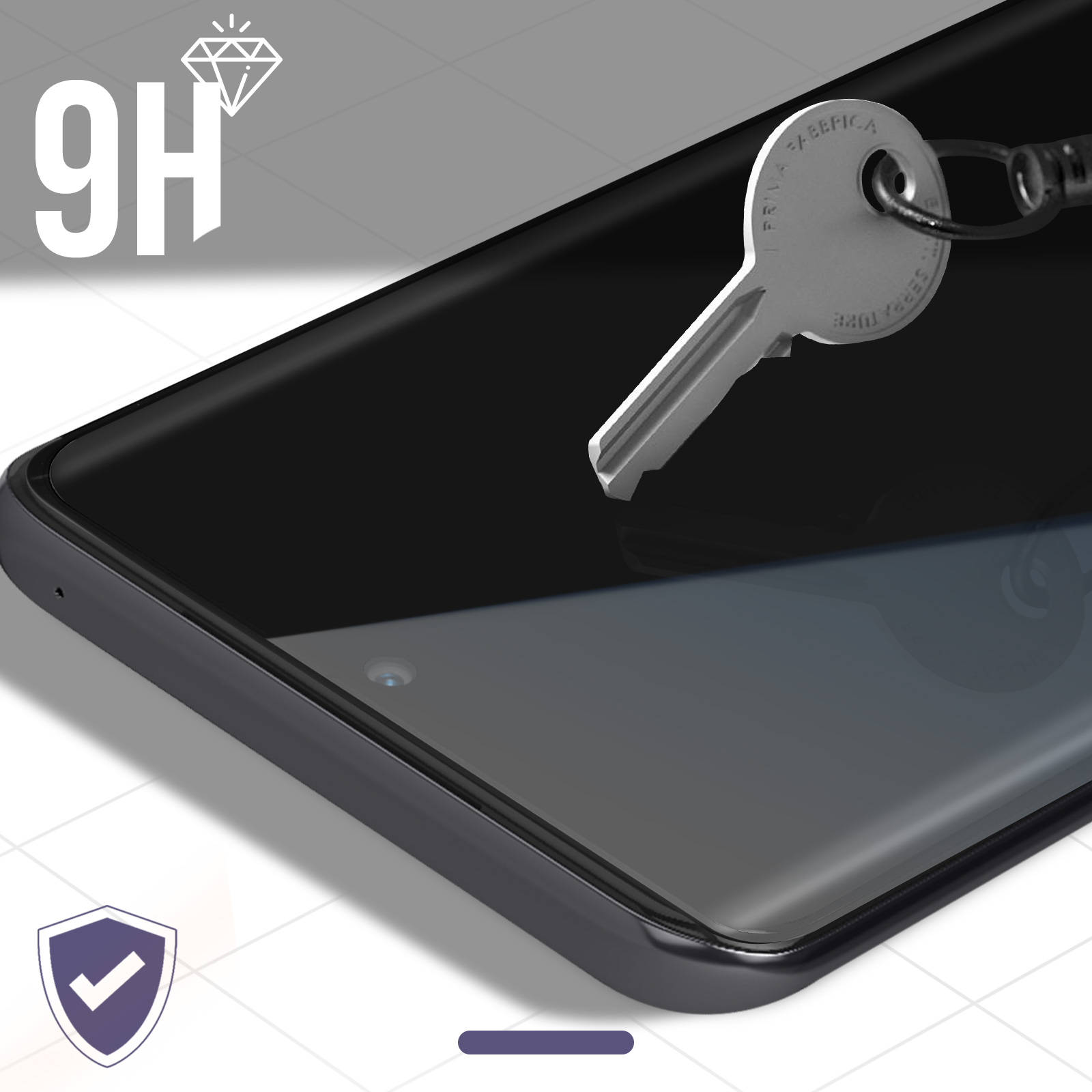 Uno schermo del telefono con una chiave sopra. La chiave è d'argento. Il telefono è nero. Lo sfondo è bianco e grigio.