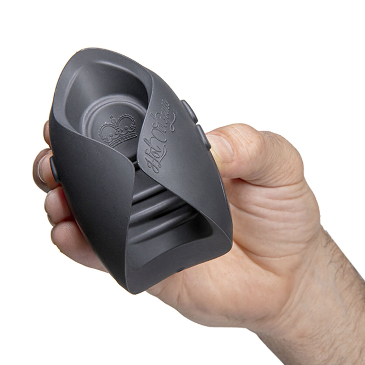 Czarny przedmiot trzymany w dłoni. Ma logo korony i jest urządzeniem.