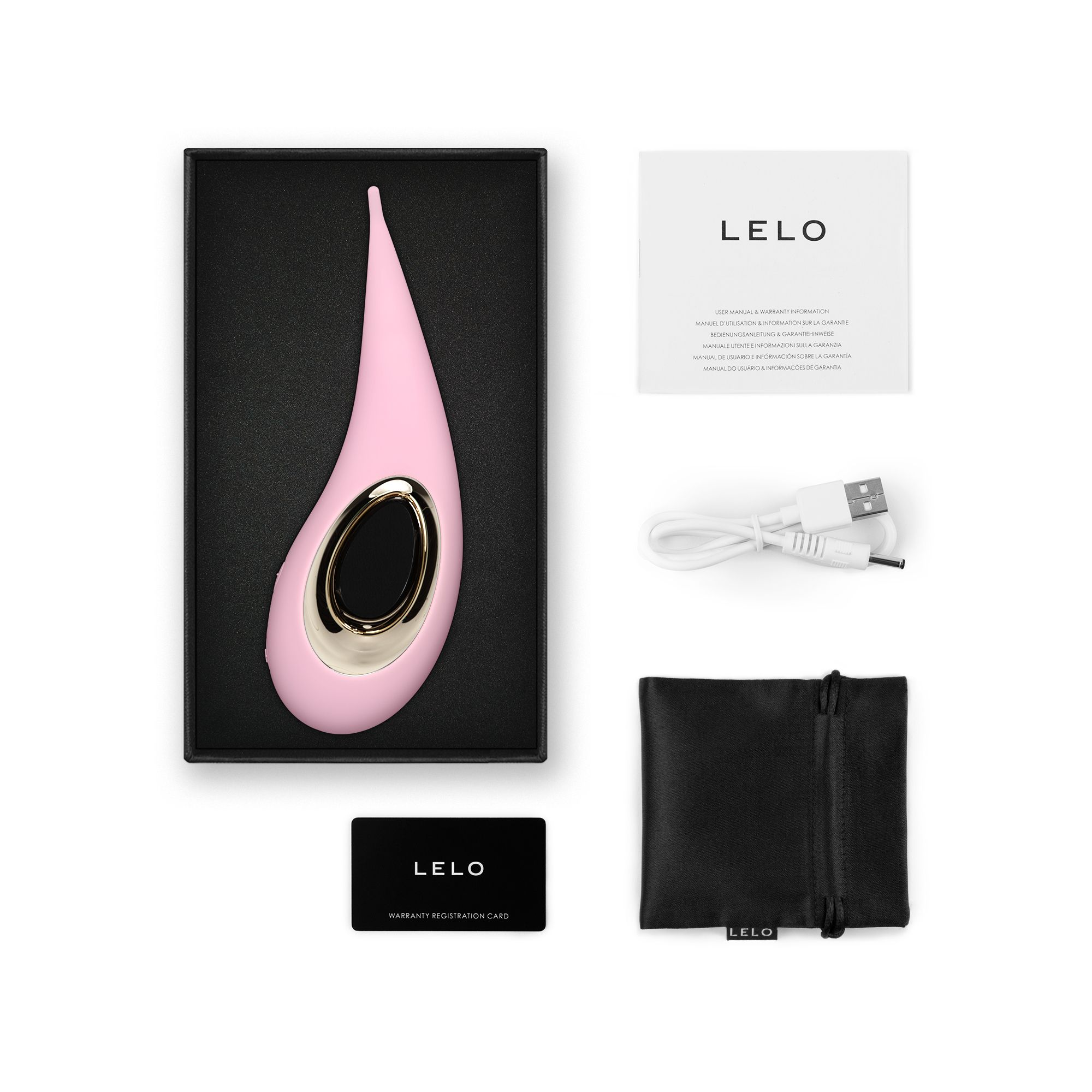 Masajeador Lelo rosa en caja, con cable de carga, tarjeta de garantía, manual y bolsa sobre fondo blanco.