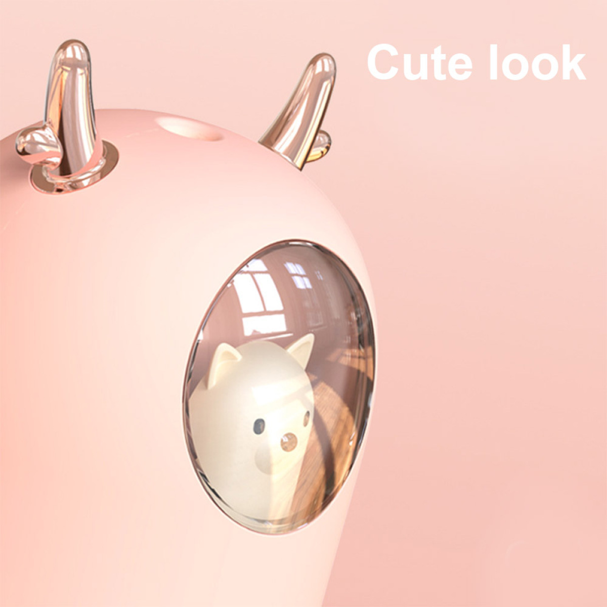 Rosa hirschförmiger Luftbefeuchter mit einer Katzenfigur in einer durchsichtigen Kuppel. "Cute look".