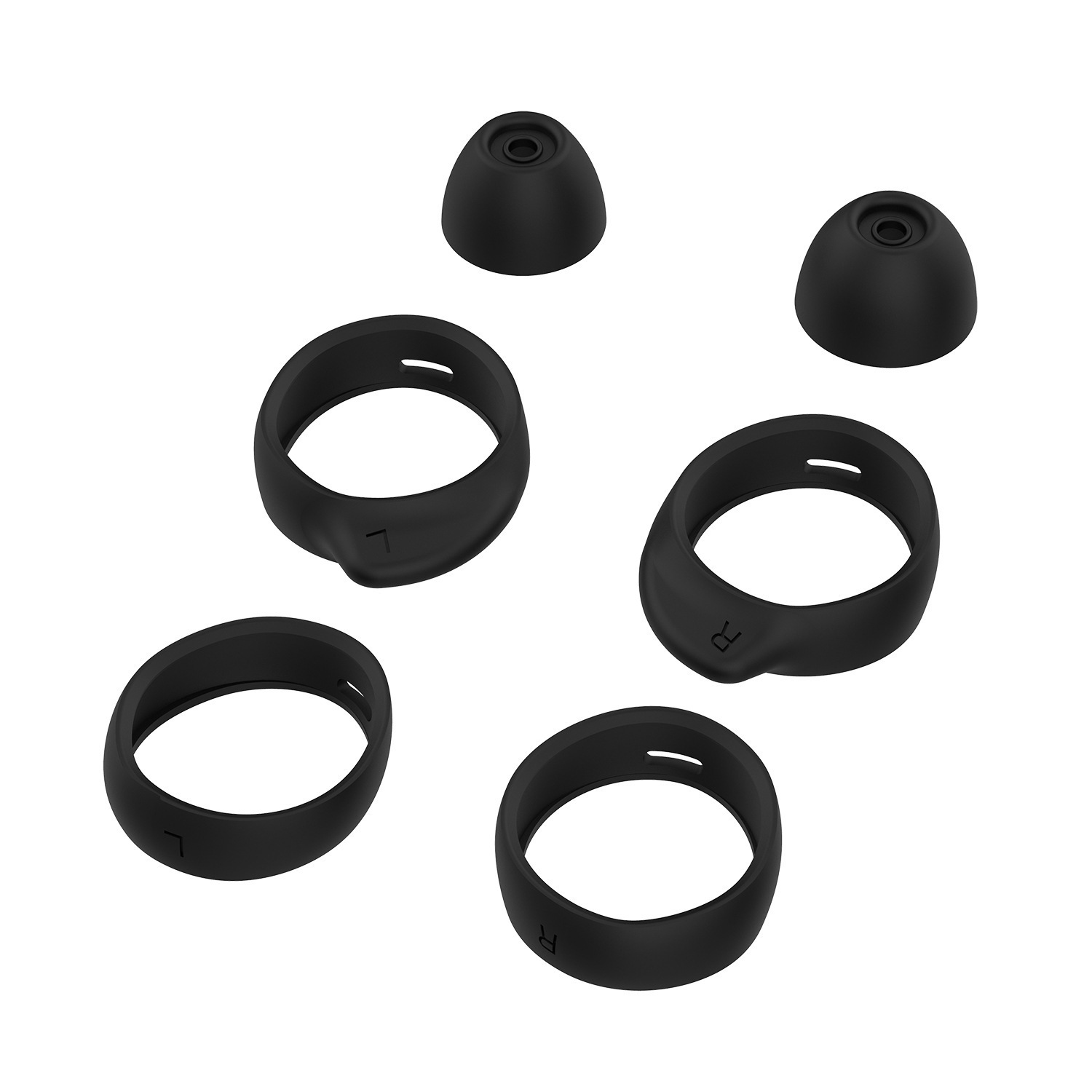 Set zwarte oortips en ringen voor oordopjes, liggend op een wit oppervlak.