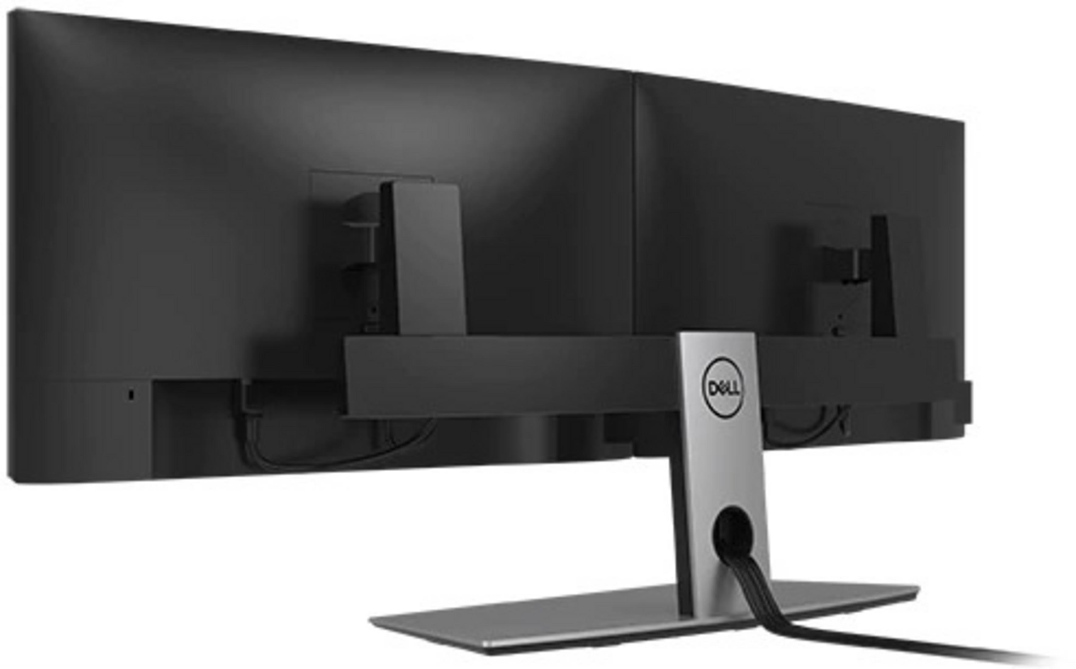 Tył dwóch czarnych monitorów komputerowych z logo Dell na srebrnej podstawie. Kable są widoczne.