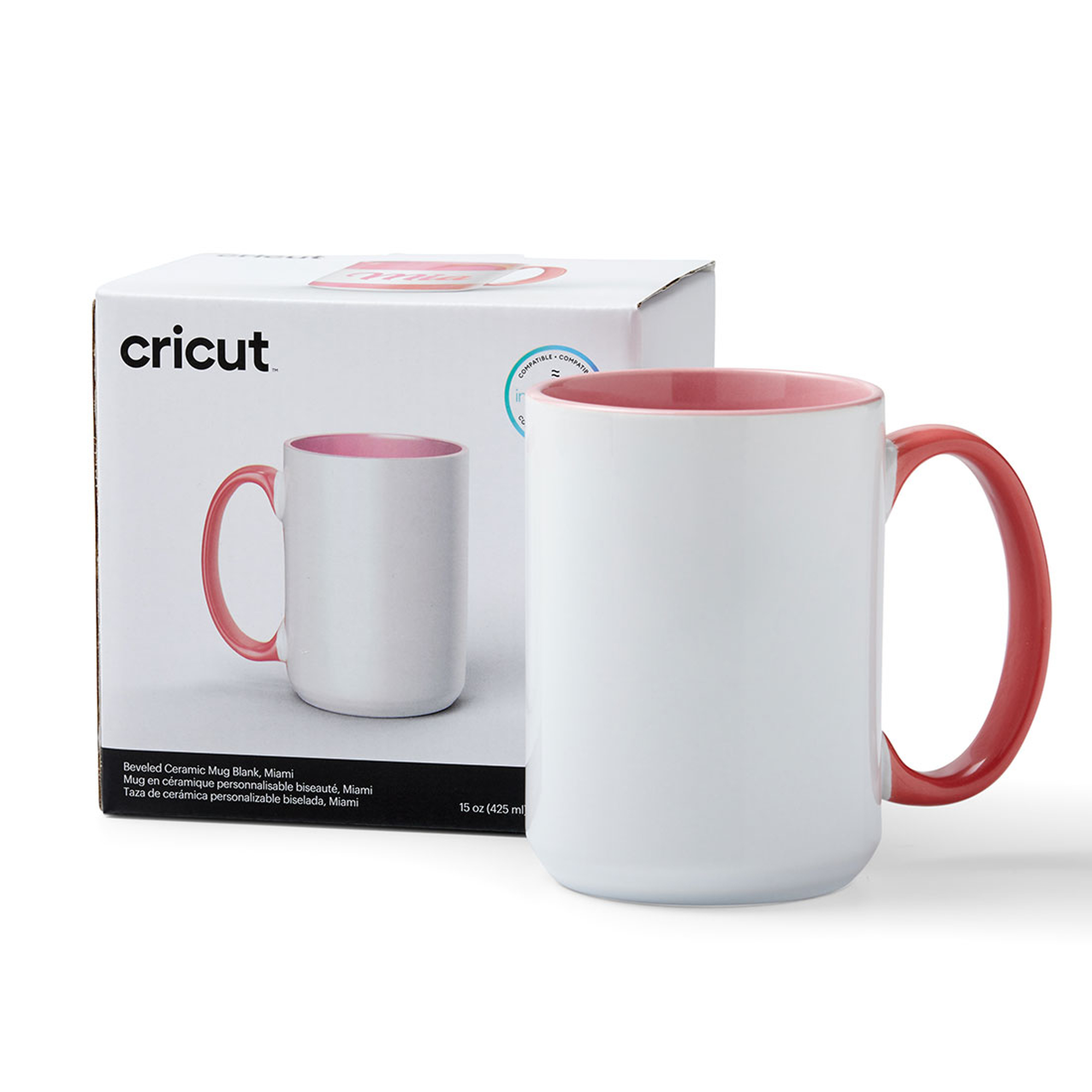 Weißer Becher mit rosa Innenraum und Henkel, neben der Verpackung. Cricut Marke.