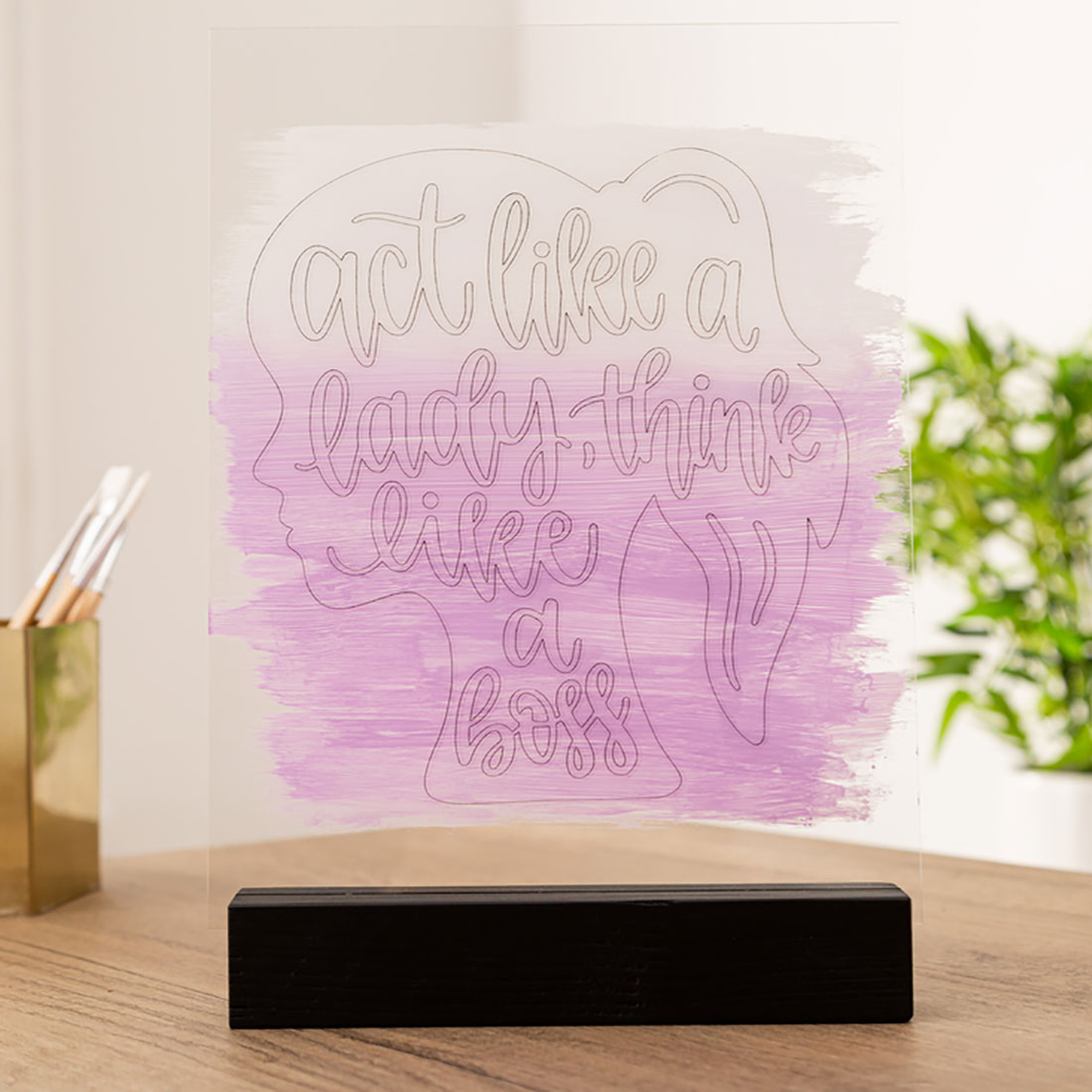 Acryl-Kunstwerk mit gemalter Frauensilhouette und den Worten 'act like a lady...'