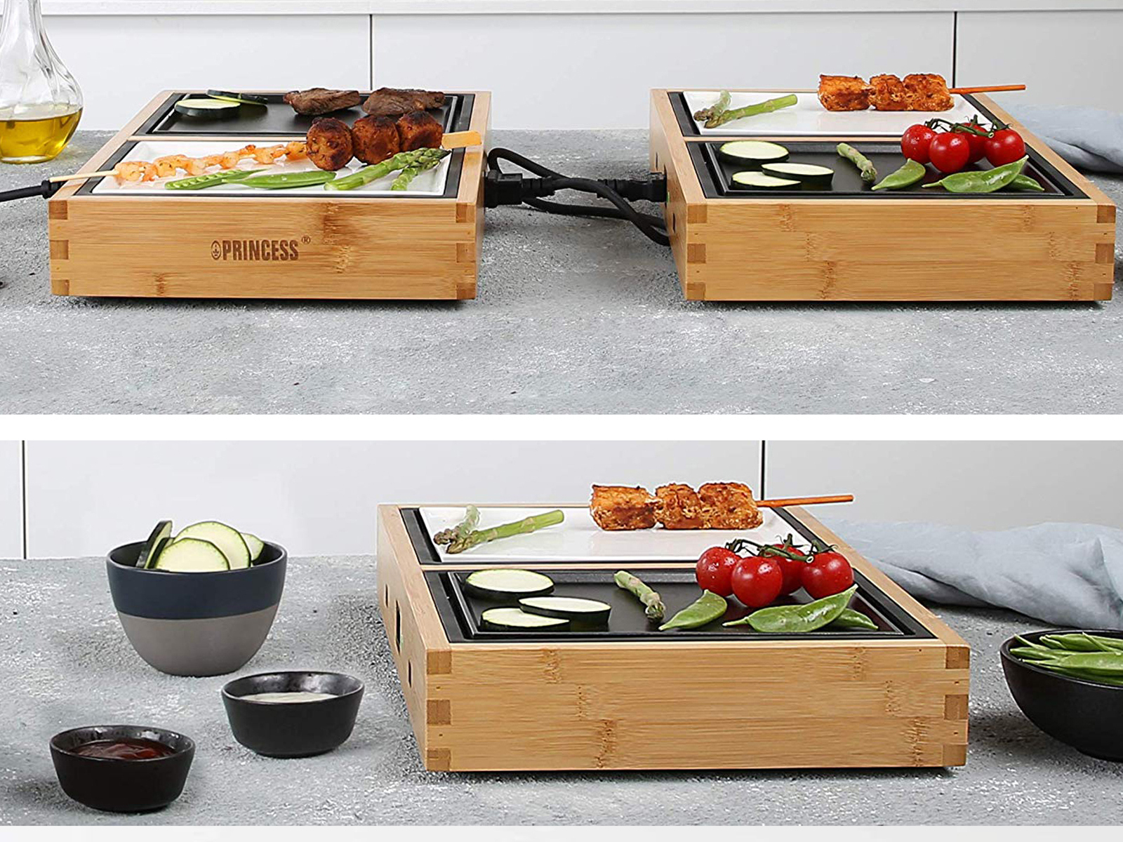 Zwei hölzerne Kochplatten mit Essen. Eine hat Spieße, die andere Gemüse. Schwarze Schalen und Teller.