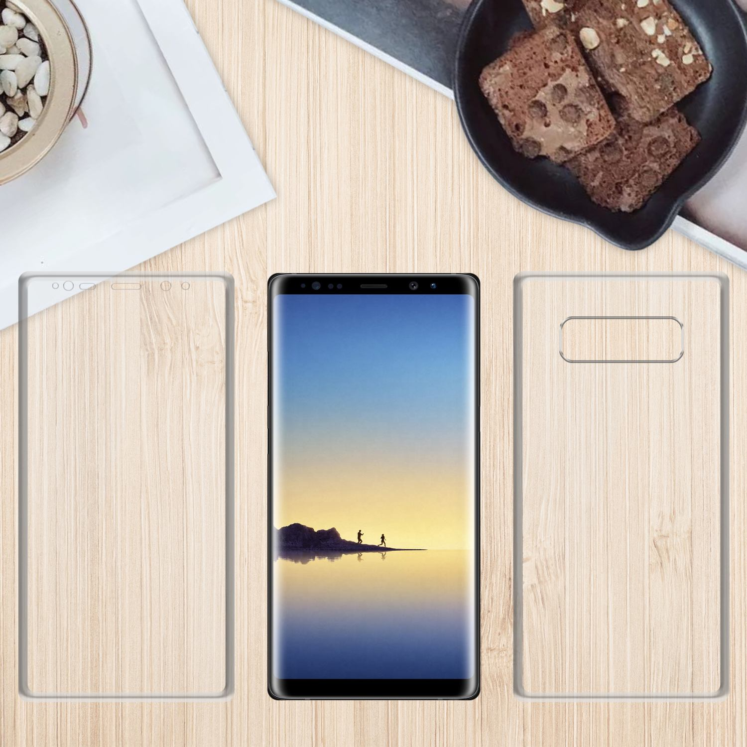 Ein Telefon mit Bildschirmschutz und einem hölzernen Hintergrund mit Lebensmitteln im Hintergrund.