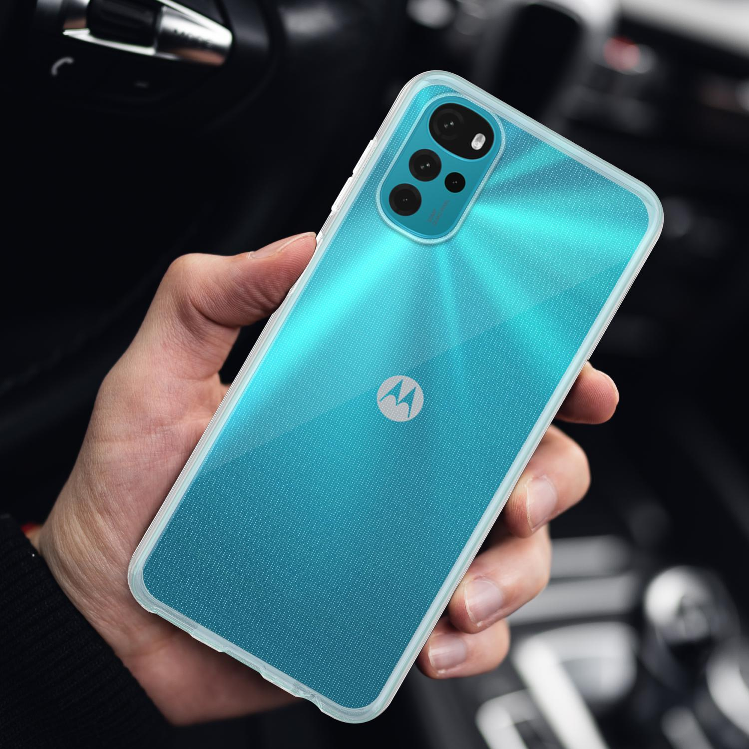 Mano che tiene un telefono azzurro con una custodia bianca. Il logo Motorola è visibile.