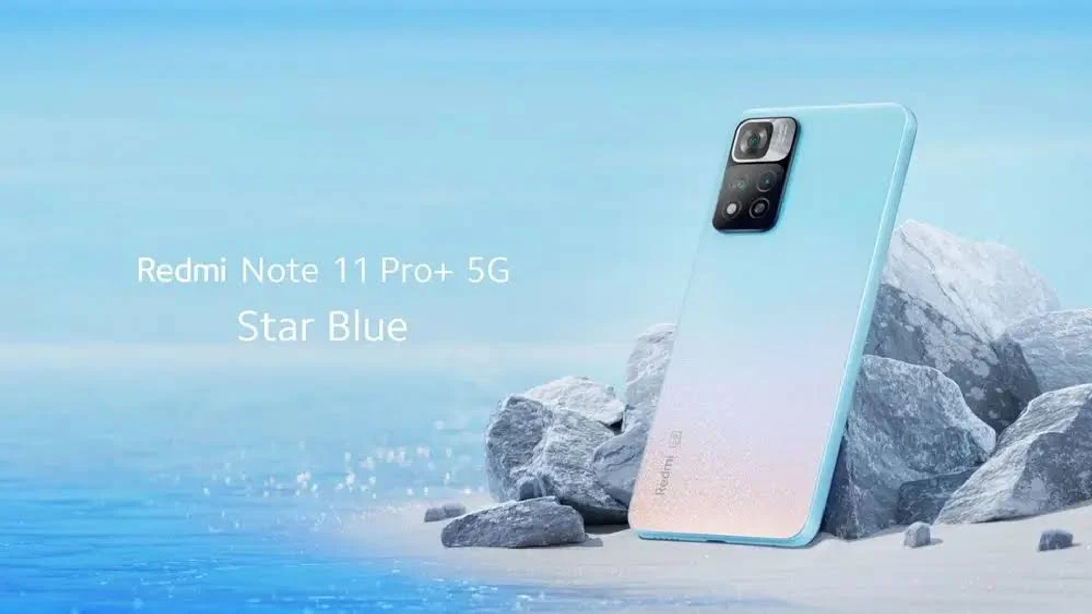 Blue Redmi phone on a beach with rocks. Text: Redmi Note 11 Pro+ 5G Star Blue.