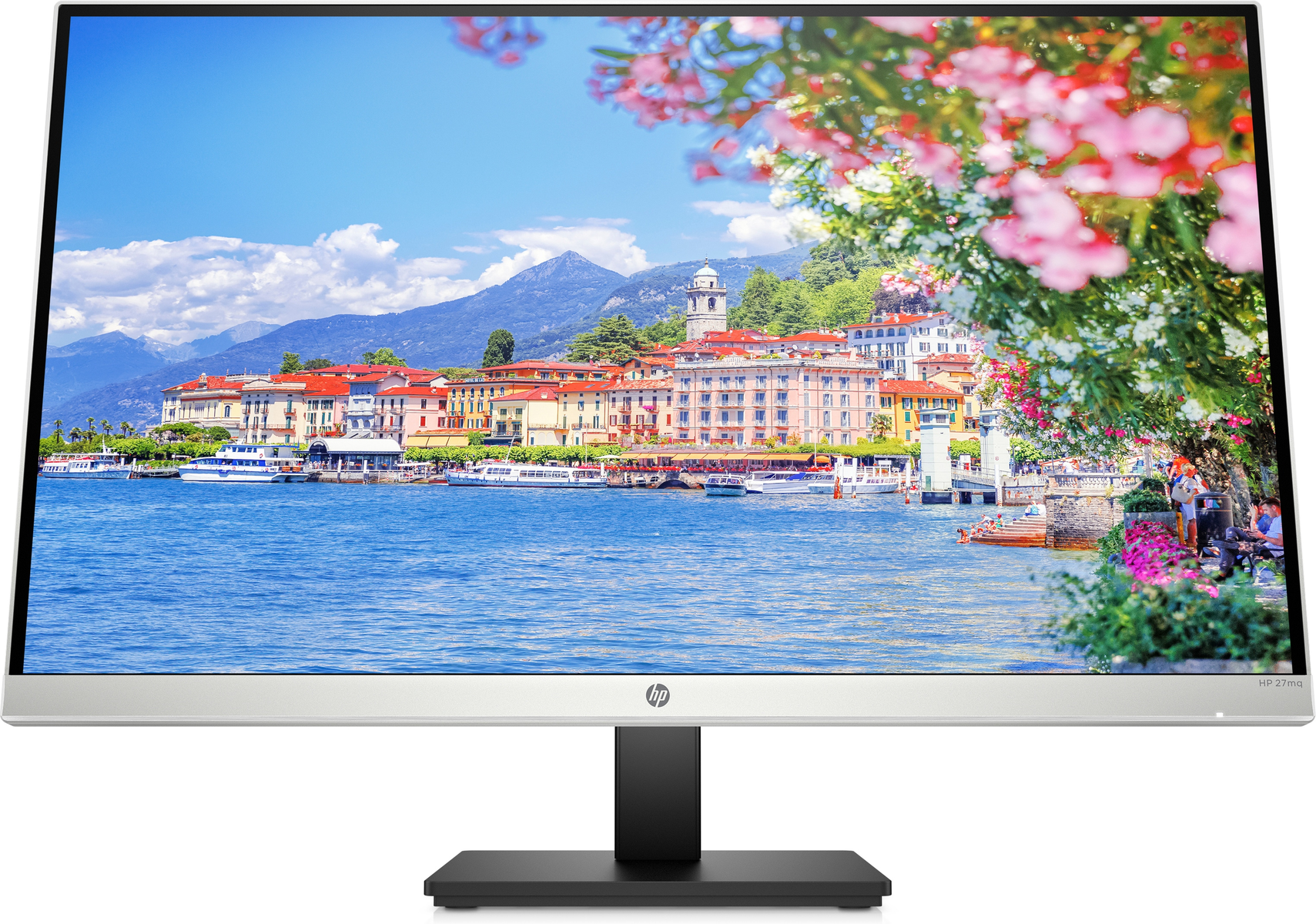 Monitor che mostra un paesaggio con acqua, edifici e montagne.