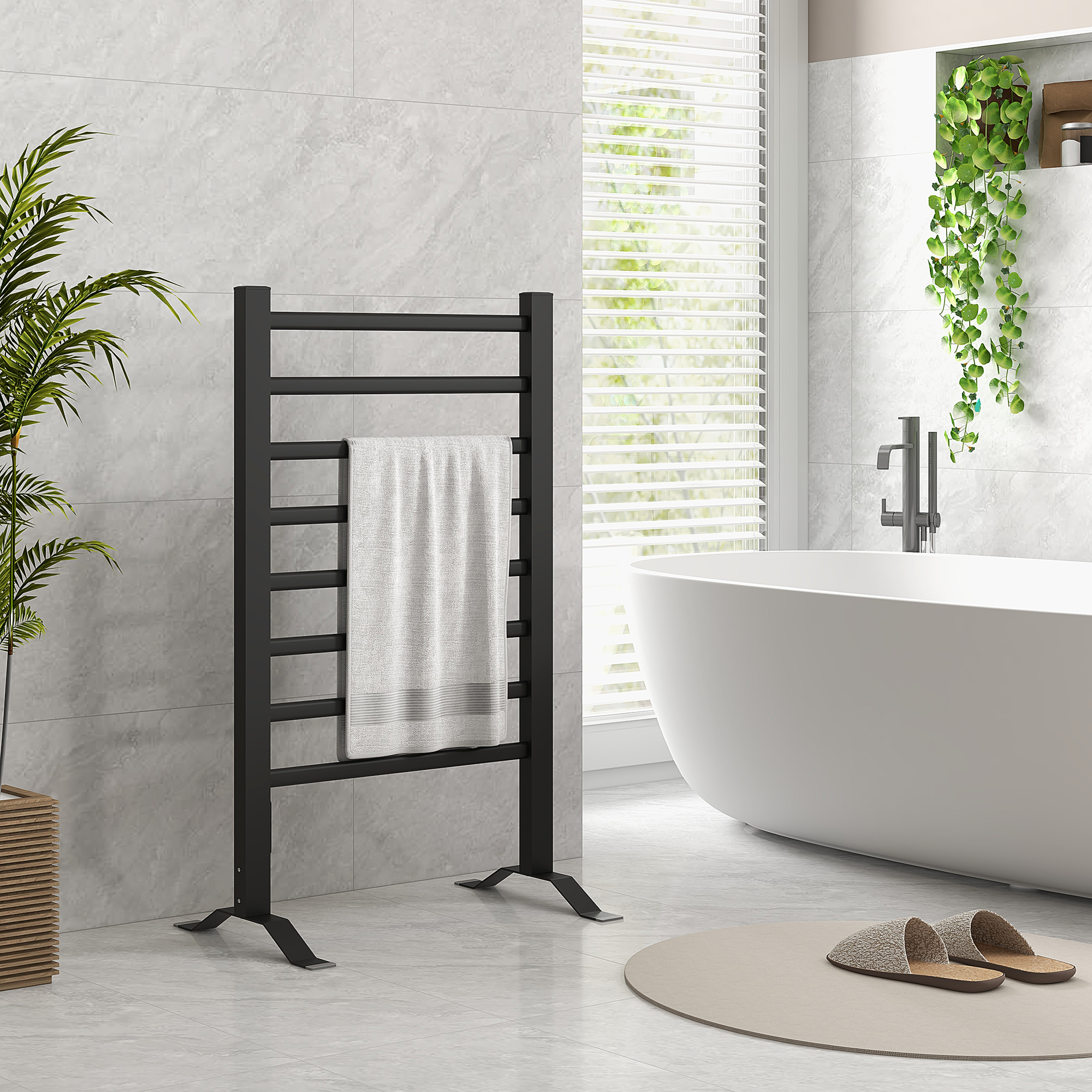 Toallero negro con toalla blanca en un baño moderno.