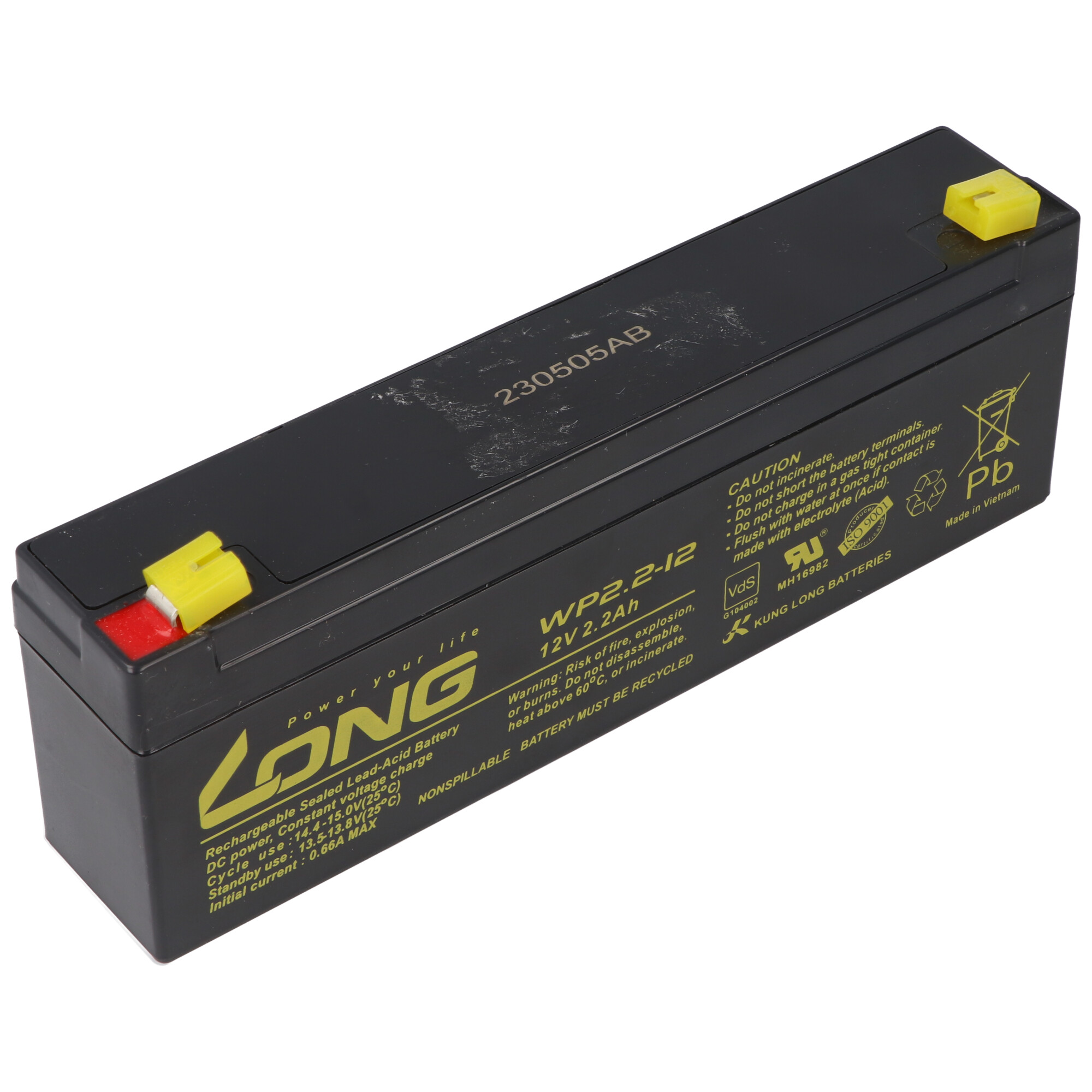 Schwarze rechteckige Batterie mit Warnhinweisen und Spezifikationen. Gelbe Endkappen.