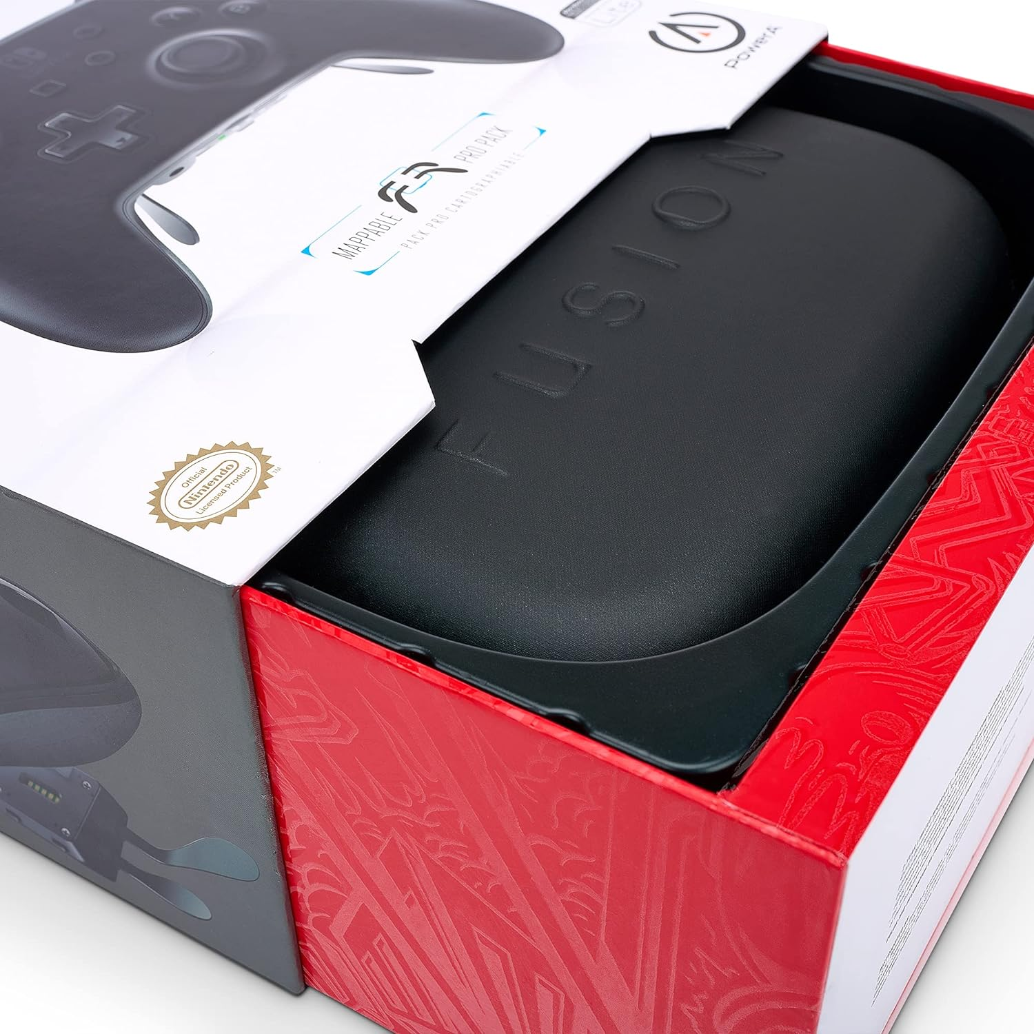 A gaming controller in a box. The box is red and white, with the controller visible inside.