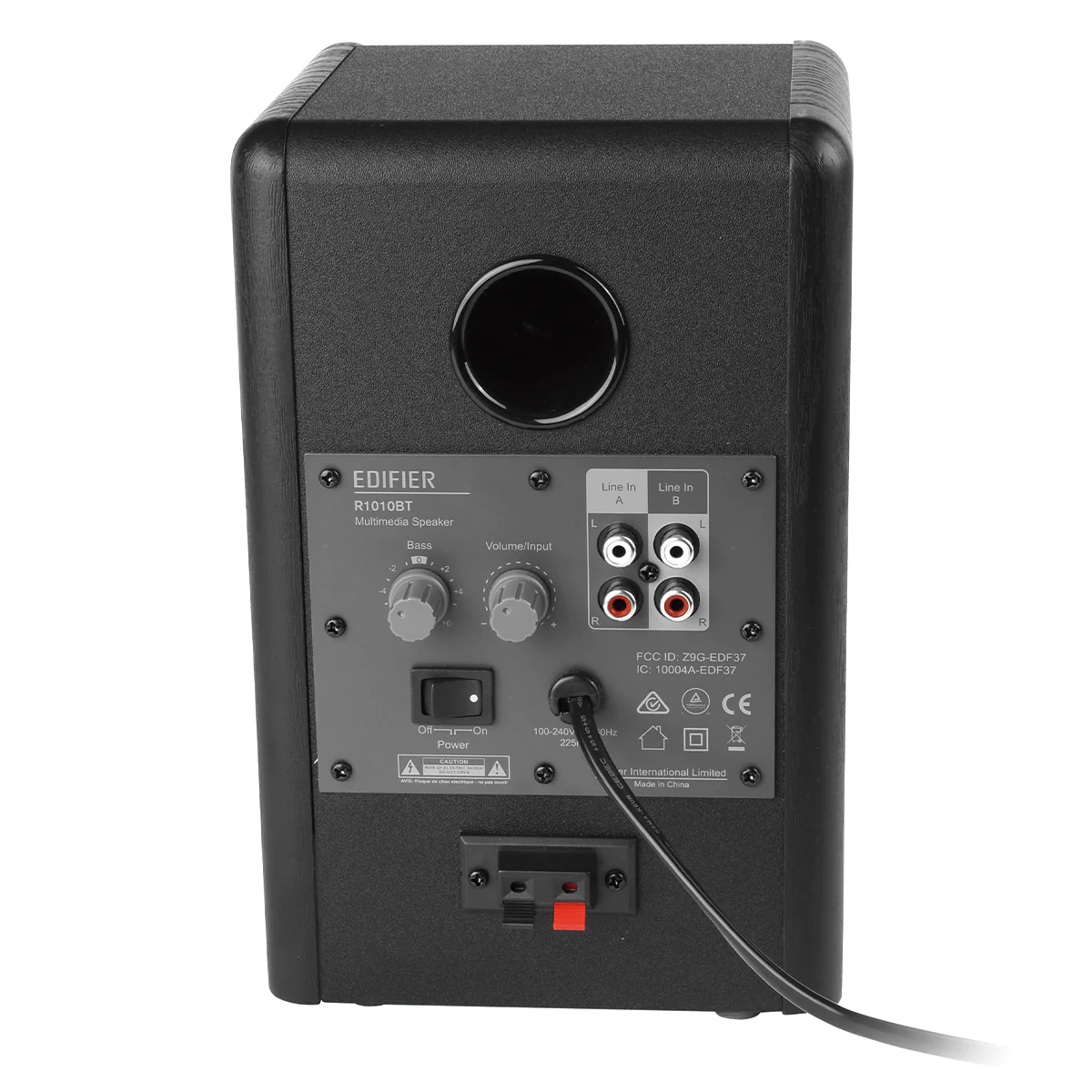 Czarny głośnik, pokazujący tylny panel z przyciskami i wejściami.