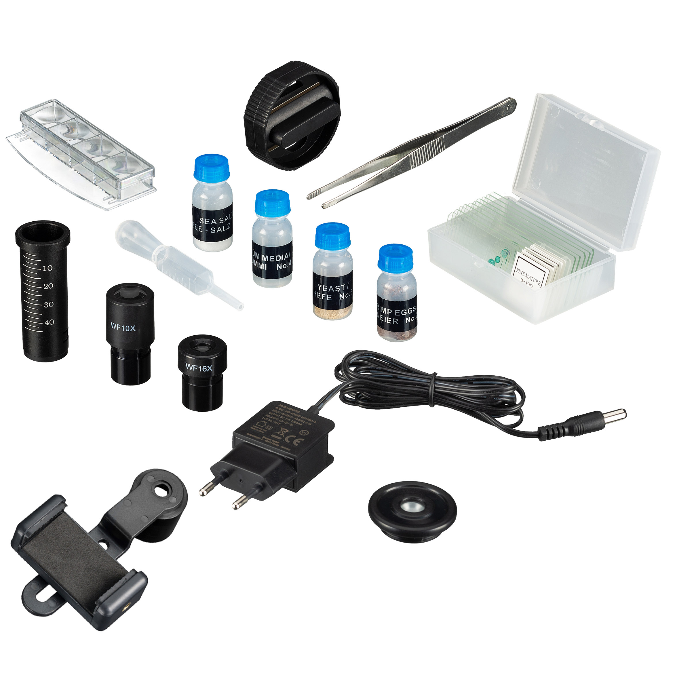 Mikroskop-Kit mit verschiedenen Komponenten, darunter Fläschchen, Objektträger und ein Netzteil.