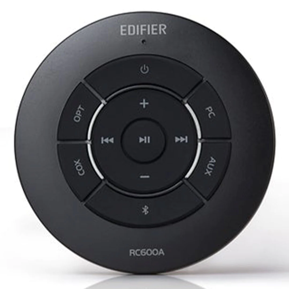 Czarny okrągły pilot z przyciskami oznaczonymi: OPT, COX, PC, AUX, bluetooth i regulacja głośności.