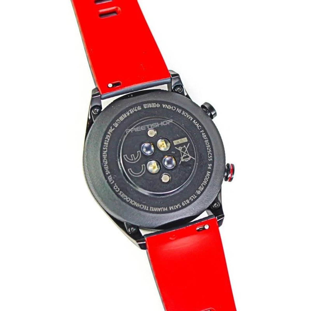 Nahaufnahme einer schwarzen Smartwatch mit rotem Armband, weißer Hintergrund.