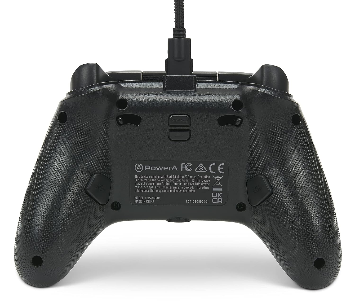 Schwarzer Gamecontroller mit mehreren Tasten. Die Rückseite zeigt Text und Logos.