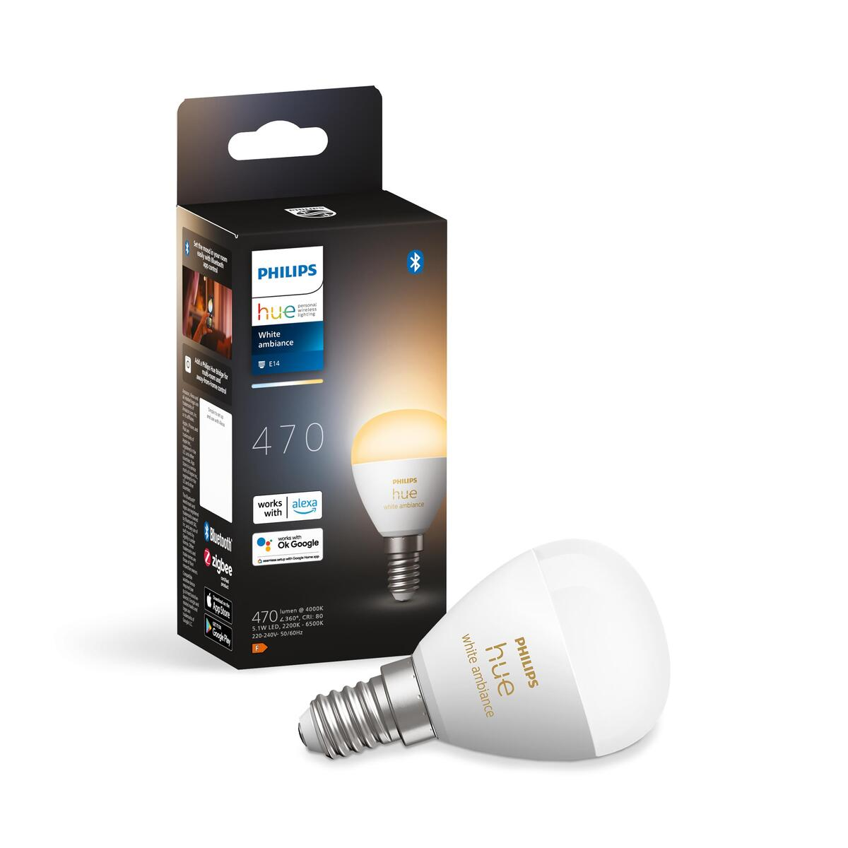 Biała i srebrna żarówka Philips Hue i jej pudełko. Żarówka leży obok pudełka.