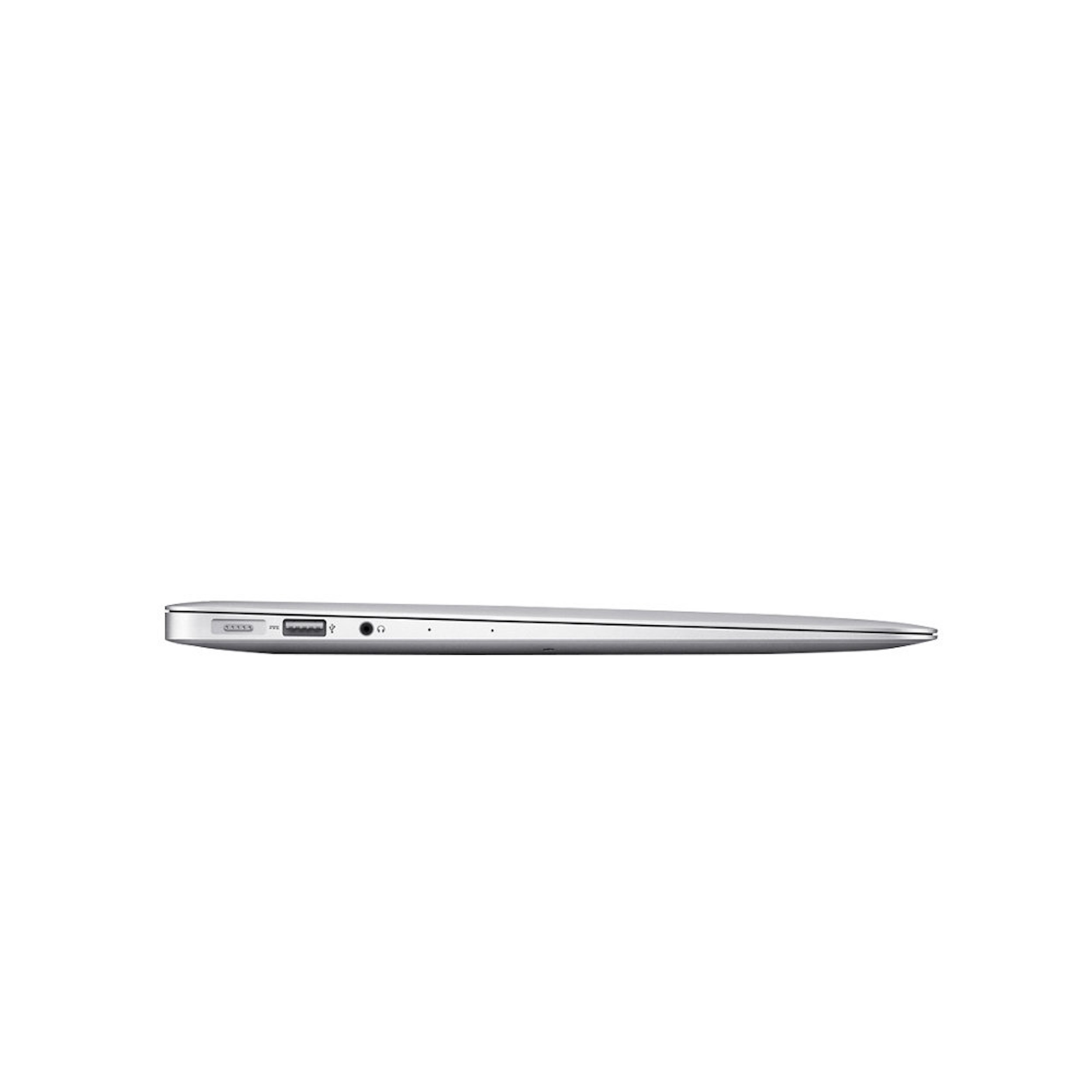 Laptop plateado de lado, cerrado. Tiene puertos. Fondo blanco.