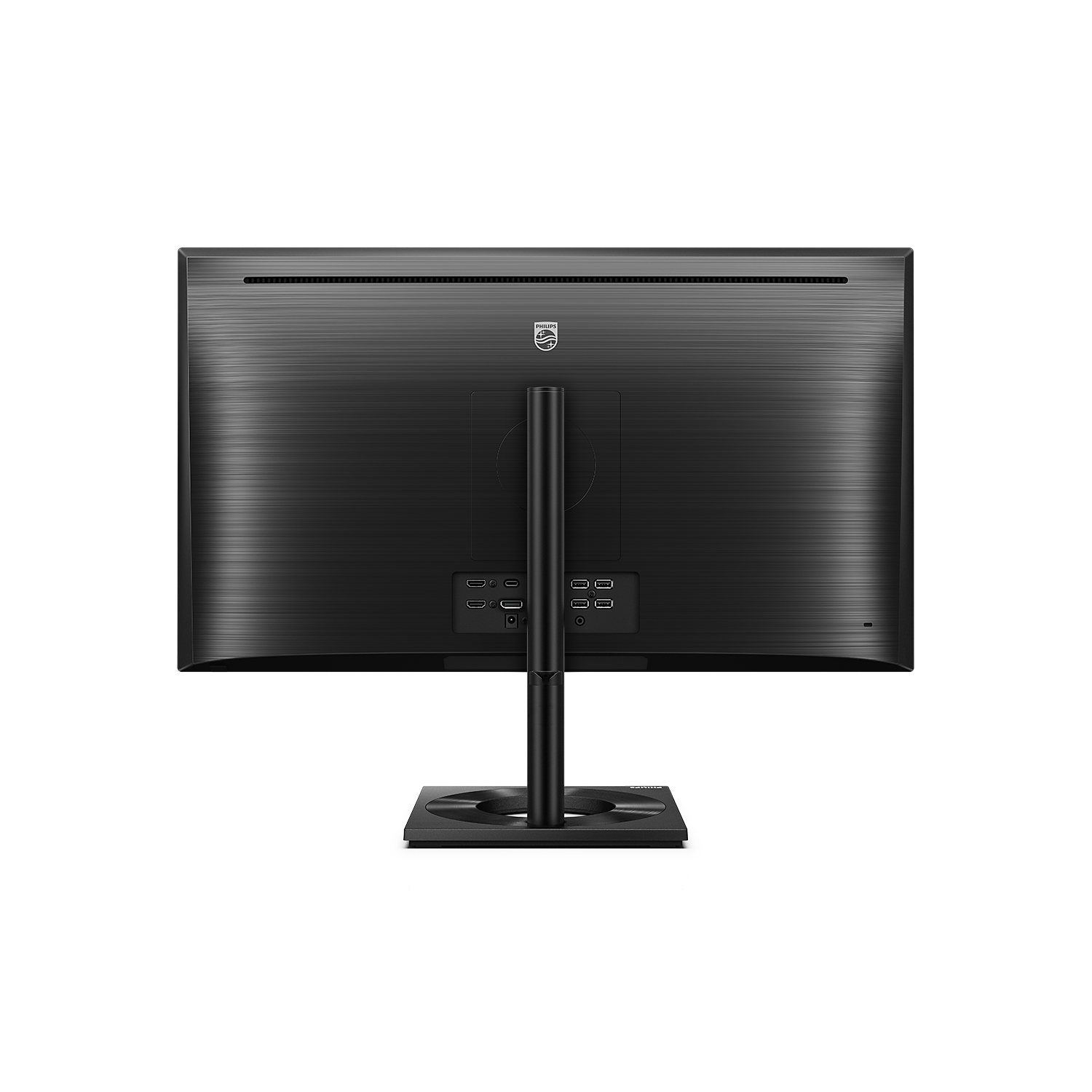 Un monitor de computadora, negro con soporte negro, vista trasera. La pantalla es negra.