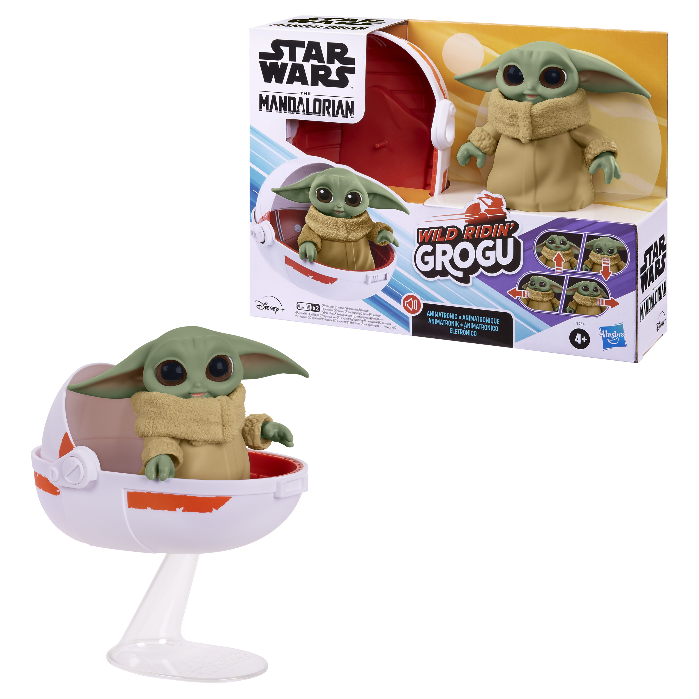 Juguete Grogu en cuna, arte de la caja muestra Grogu en una speeder. Cuna blanca con detalles en naranja.