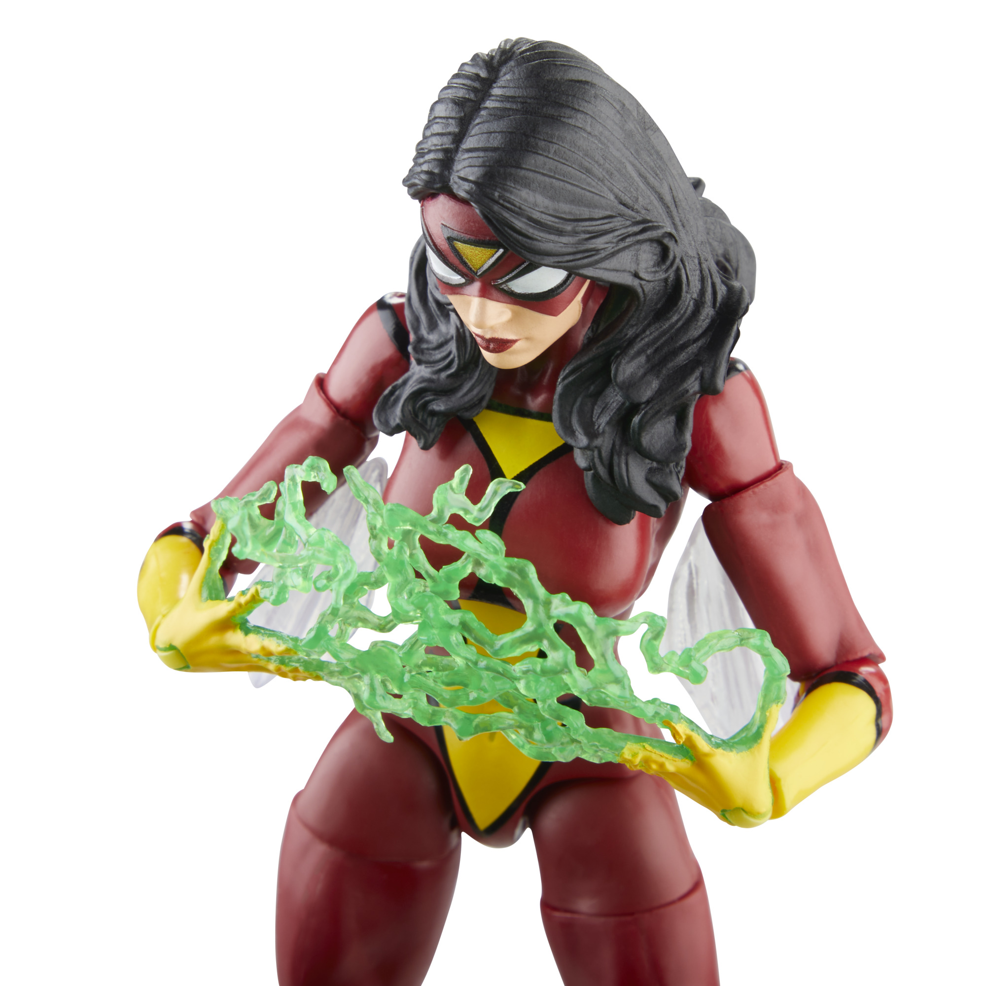 Figura de acción de Spider-Woman sosteniendo explosiones de energía verde. Traje rojo y amarillo. Fondo blanco.