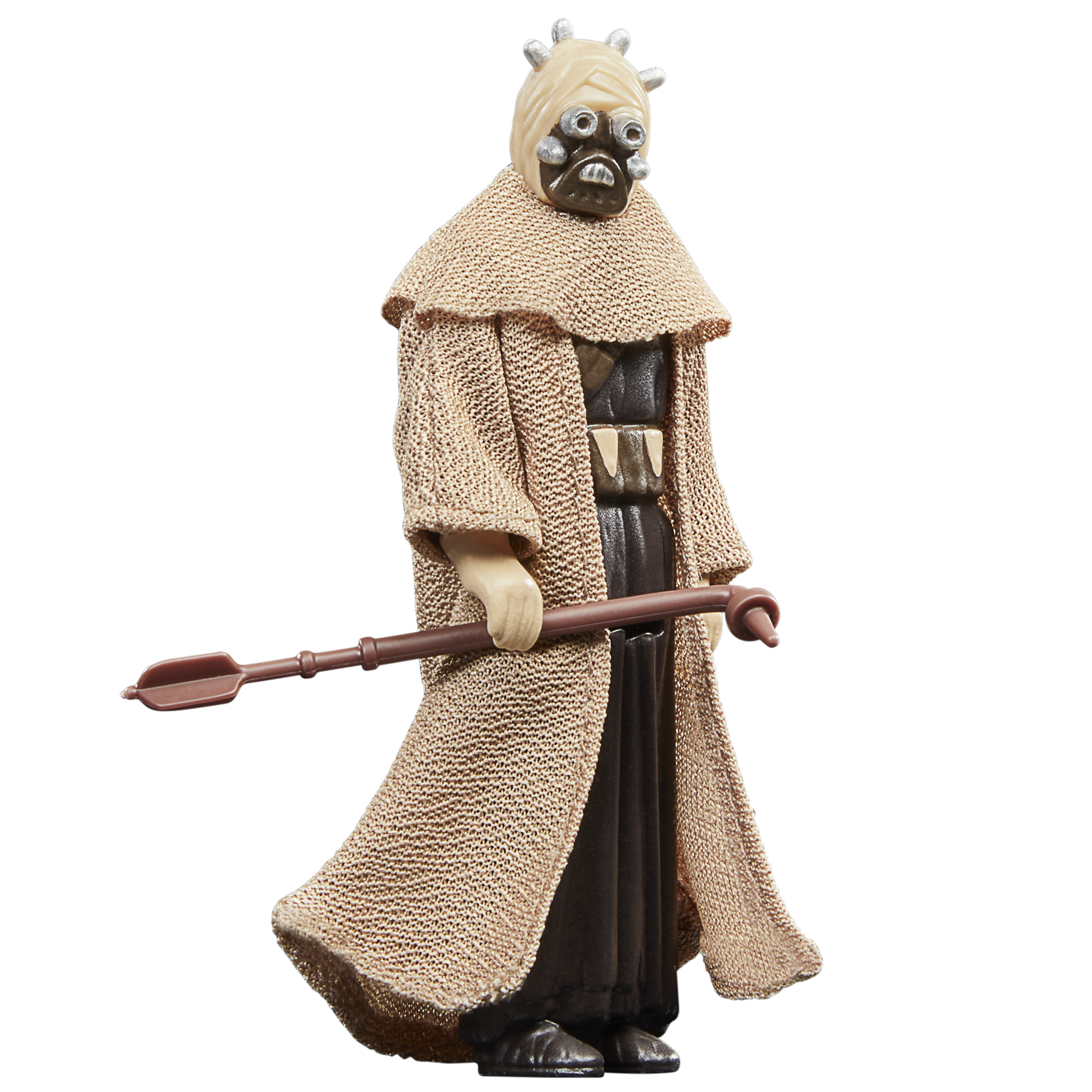 Figura de Tusken Raider con túnica beige y bastón. La figura está de pie y tiene una máscara.