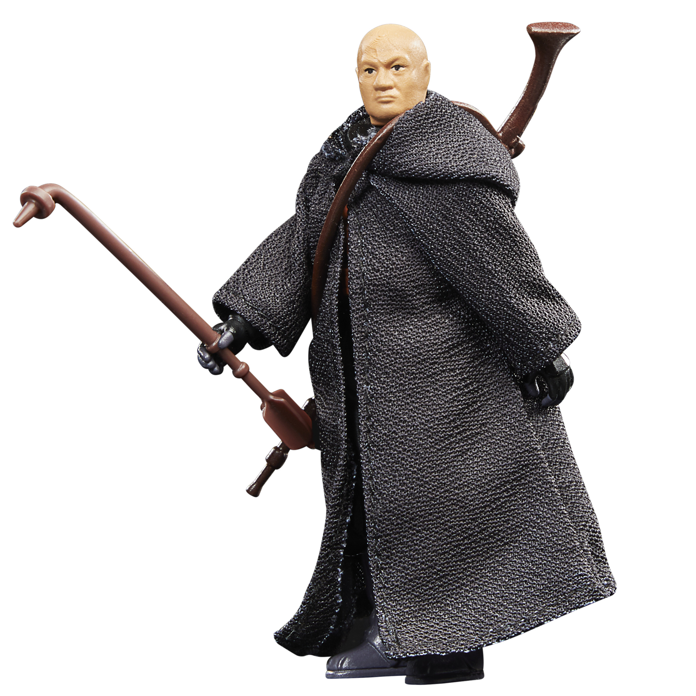 Figura calva con abrigo oscuro, sosteniendo un bastón. La figura es de Star Wars.