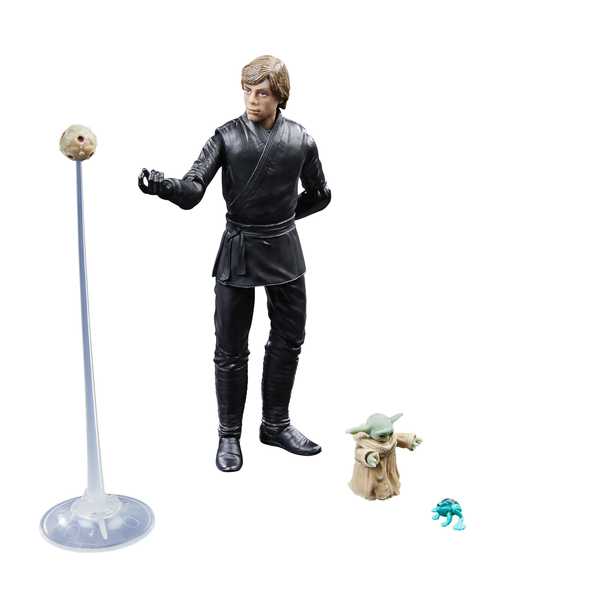 Figura de acción de Luke Skywalker con sable láser, junto a Grogu y otros accesorios.