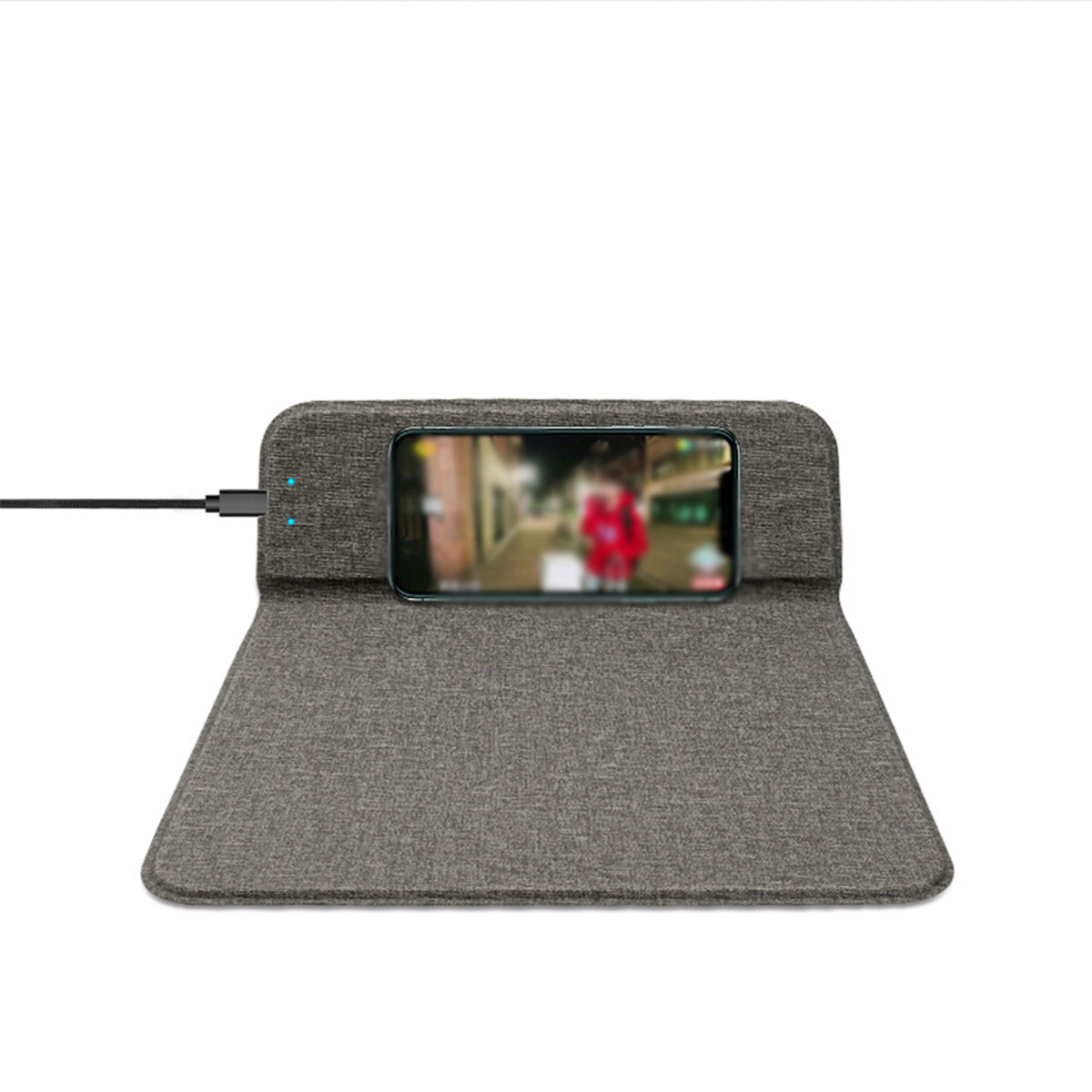 Ein Telefon auf einem grauen Ständer mit angeschlossenem Kabel.