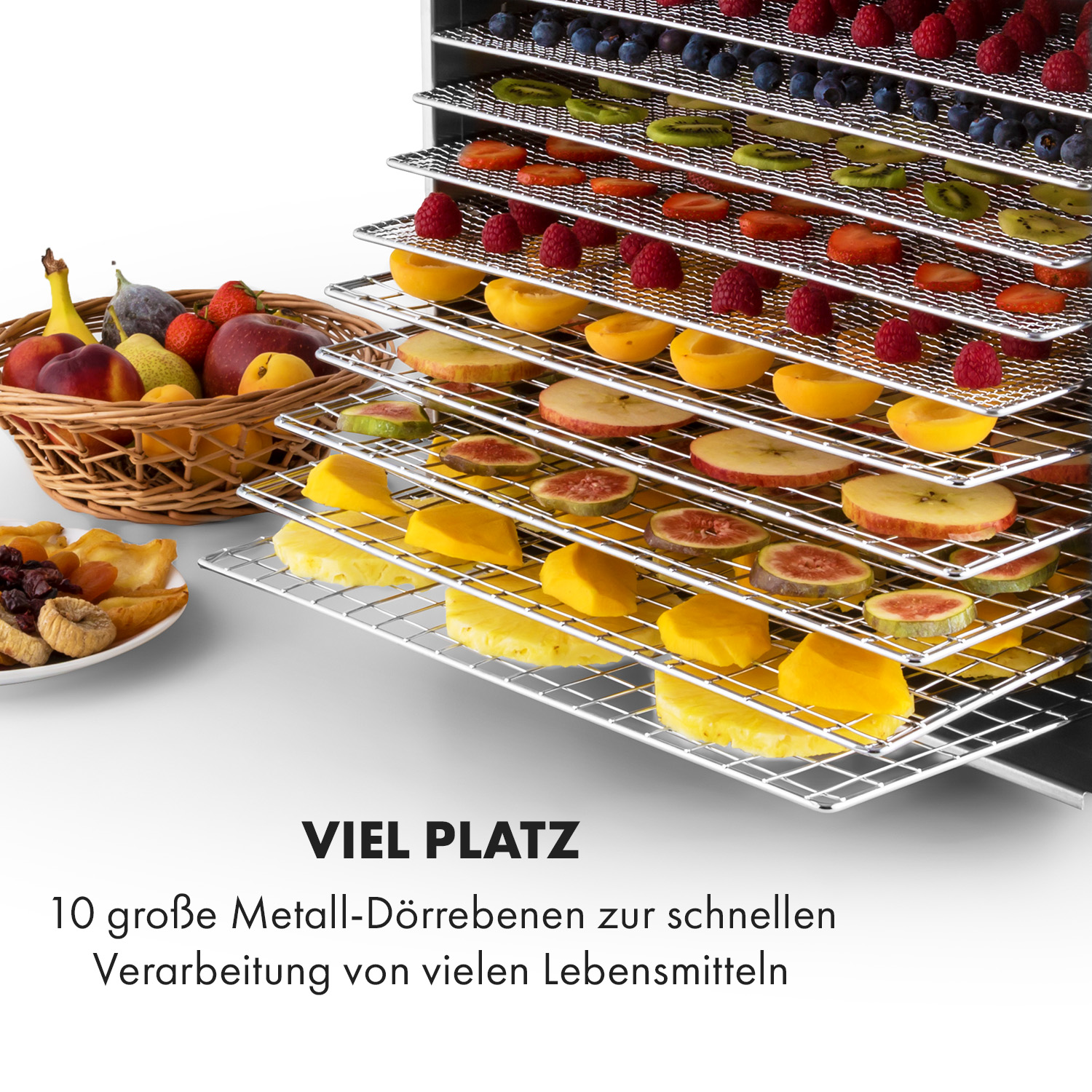 Dörrgerät mit gestapelten Tabletts mit geschnittenen Früchten. Ein Obstkorb ist links. Text unten: 'VIEL PLATZ'.