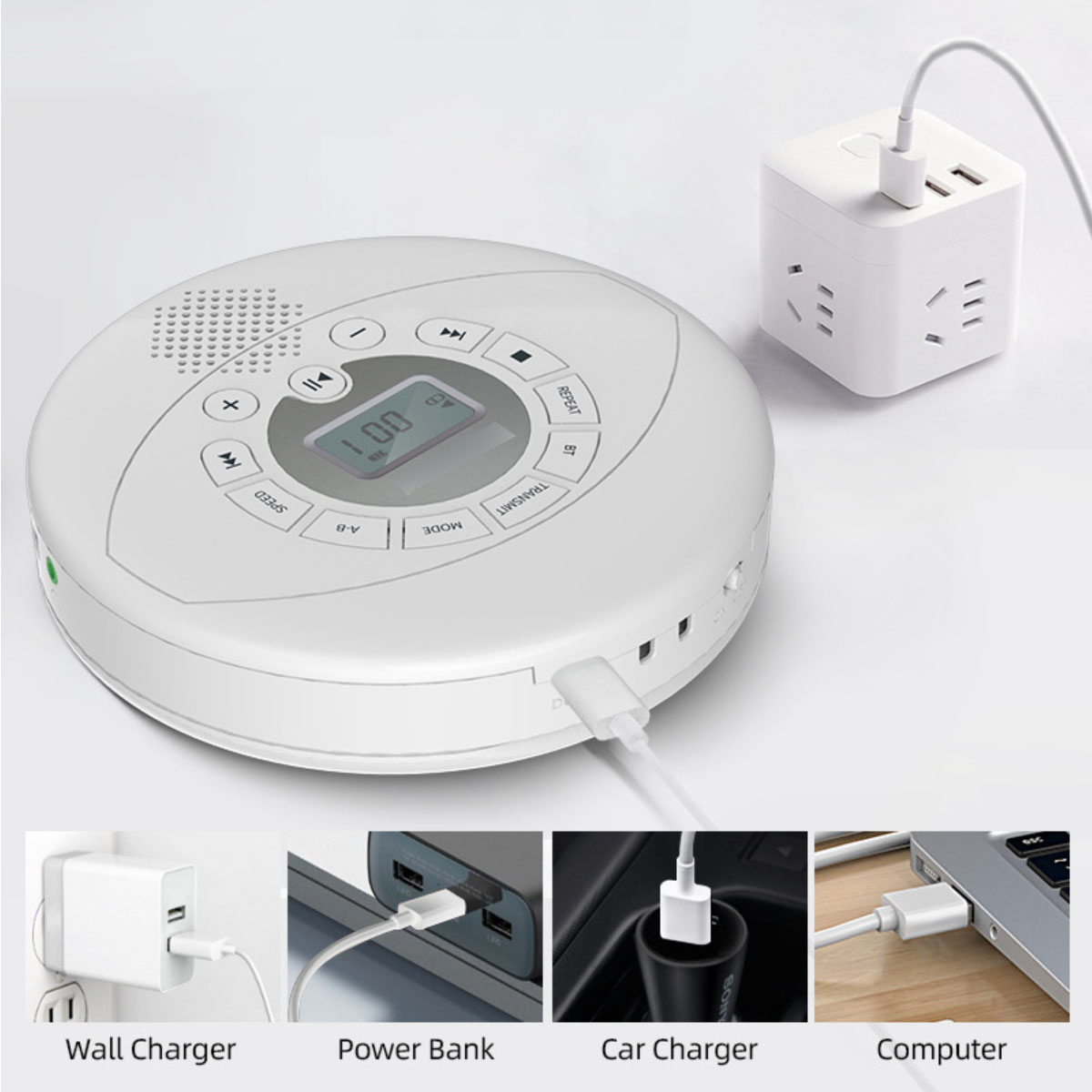 Weißer CD-Player mit Ladekabeln, die an Ladegeräten und einem Computer angeschlossen sind. Beschriftungen unten.