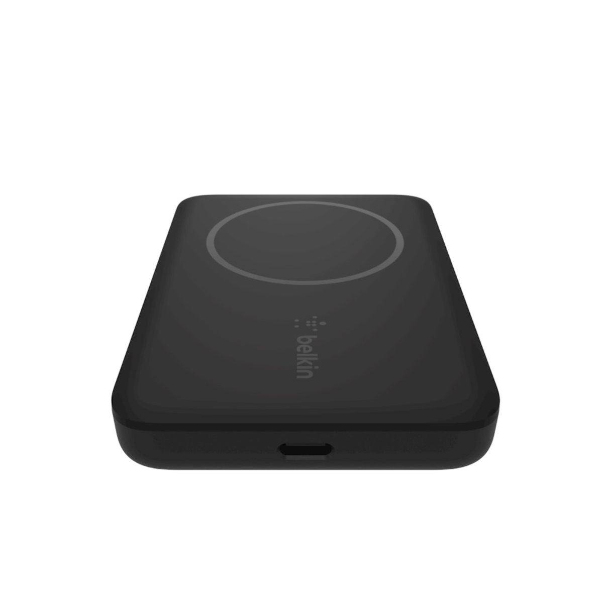 Base di ricarica wireless nera con area di ricarica circolare su sfondo bianco.