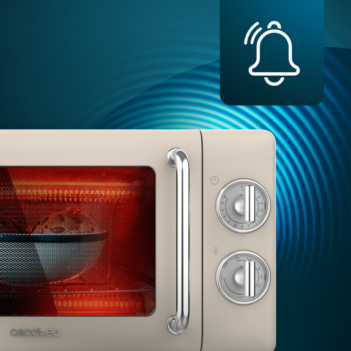 Zbliżenie beżowej kuchenki mikrofalowej z pokrętłami, uchwytem i ikoną dzwonka, tło jest rozmyte.