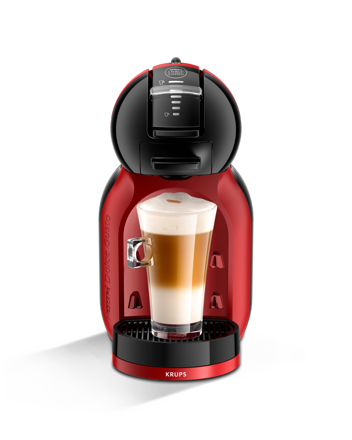 Macchina da caffè Krups Dolce Gusto rossa e nera con un bicchiere di latte. Sfondo nero.