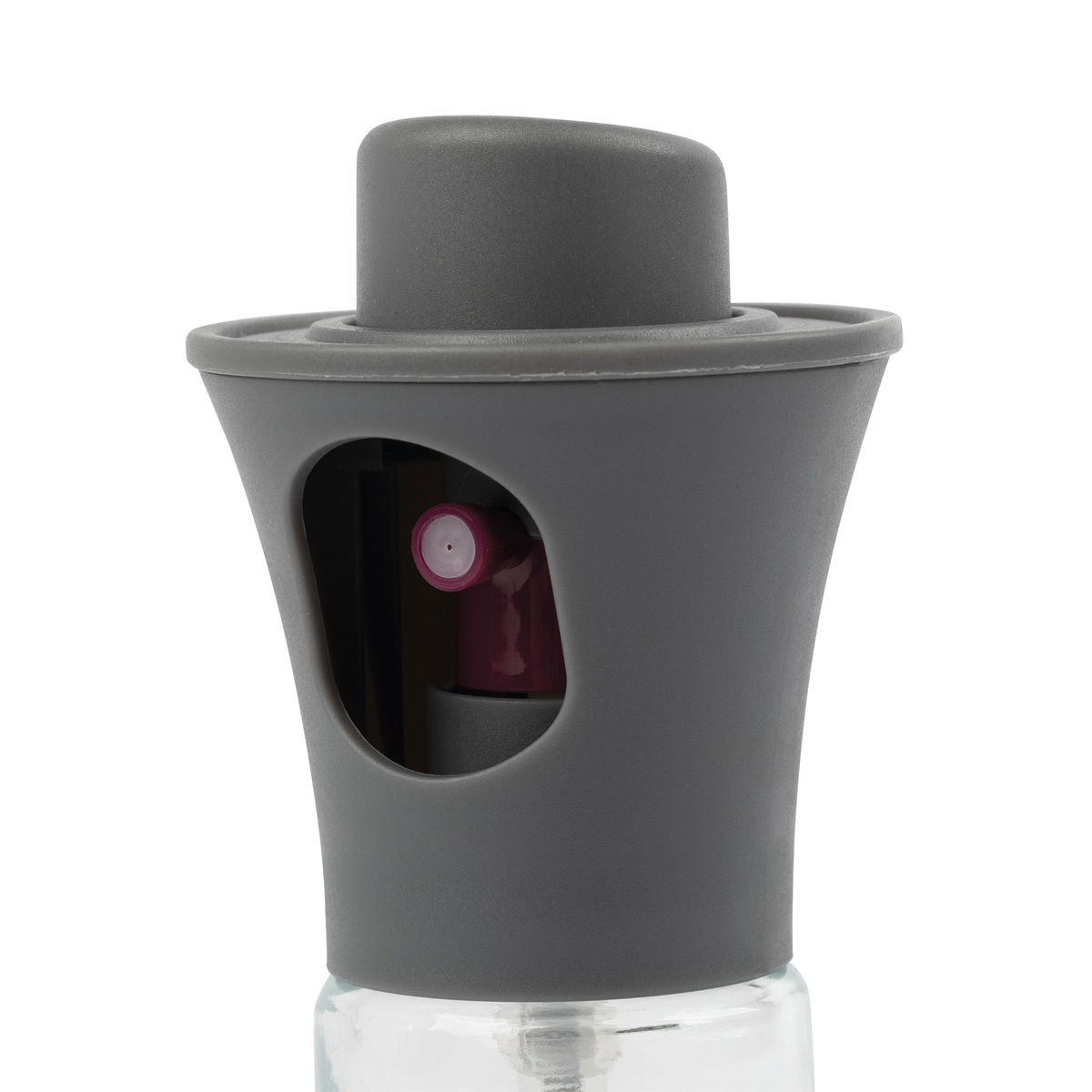 Un pulverizador de aceite gris y transparente. Tiene una tapa gris y una botella de vidrio transparente.