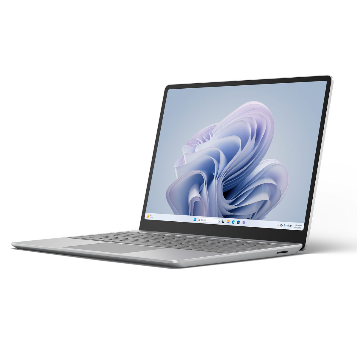 Un portátil Microsoft Surface plateado con un fondo de pantalla floral azul y morado.