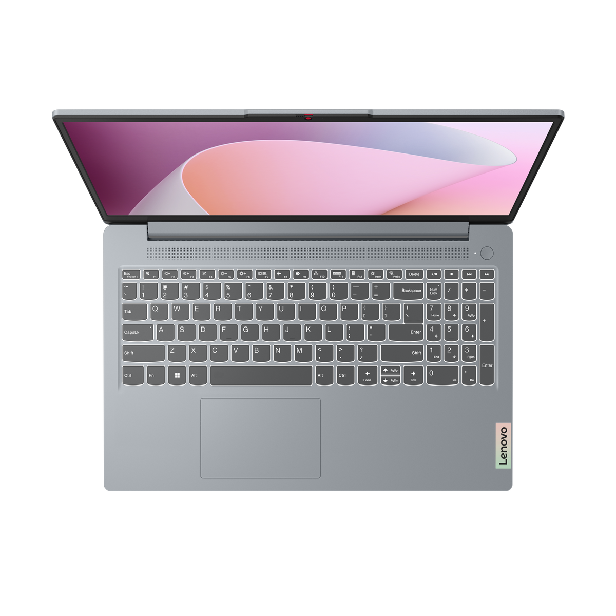 Portátil desde arriba mostrando teclado y pantalla con fondo rosa y blanco.